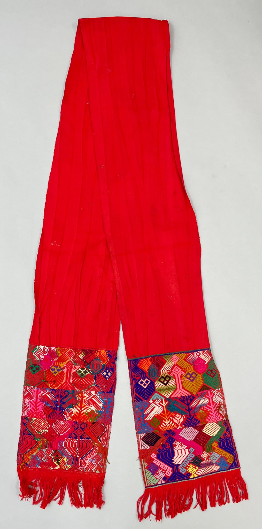San Martin Sacatepequez, Quetzaltenango, Guatemala, Vintage Woven Cotton Man's "Faja" Sash: San Martin Sacatepequez, Quetzaltenango, Guatemala, vintage woven cotton man's "Faja" sash, red ground with symbolic embroidery pattern on each end, 100"l x 9"w PROVENANCE:From the estate of Professor