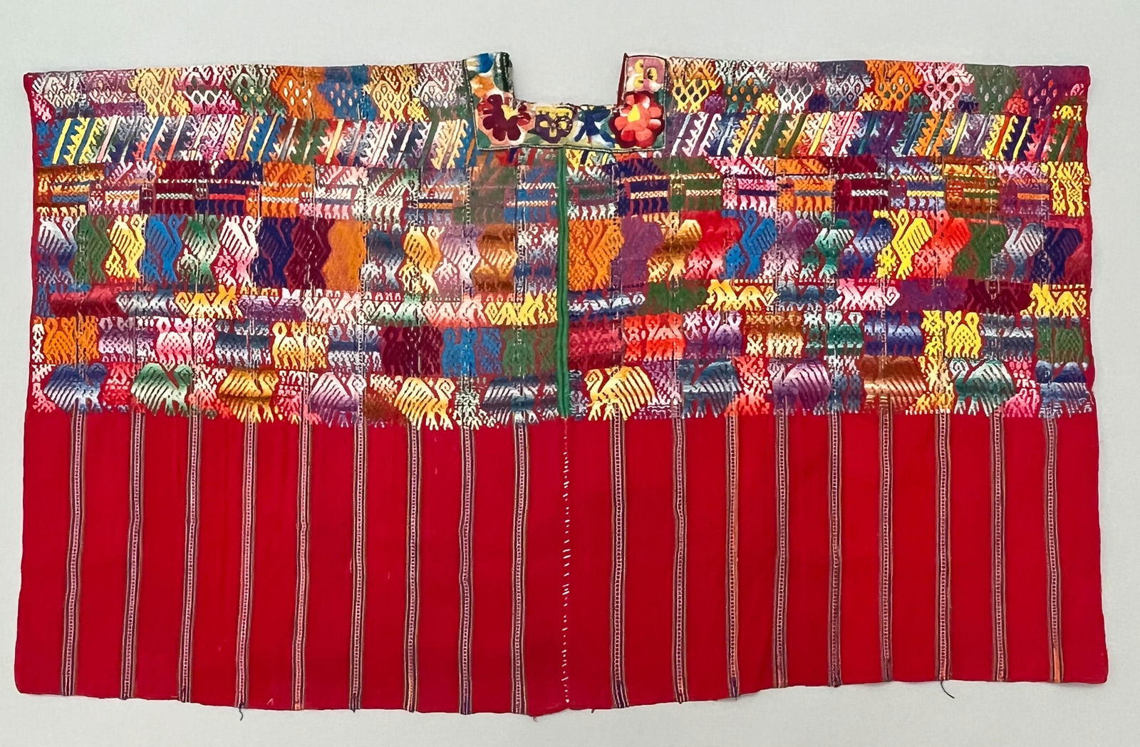 Tecpan, Department of Chimaltenango, Guatemala, Vintage Woven Cotton "Huipil" Tunic: Tecpan, Department of Chimaltenango, Guatemala, vintage woven cotton "Huipil" tunic, red ground with stripes, vibrant colors symbolic bird pattern, 26"l x 44"w PROVENANCE:From the estate of Professor
