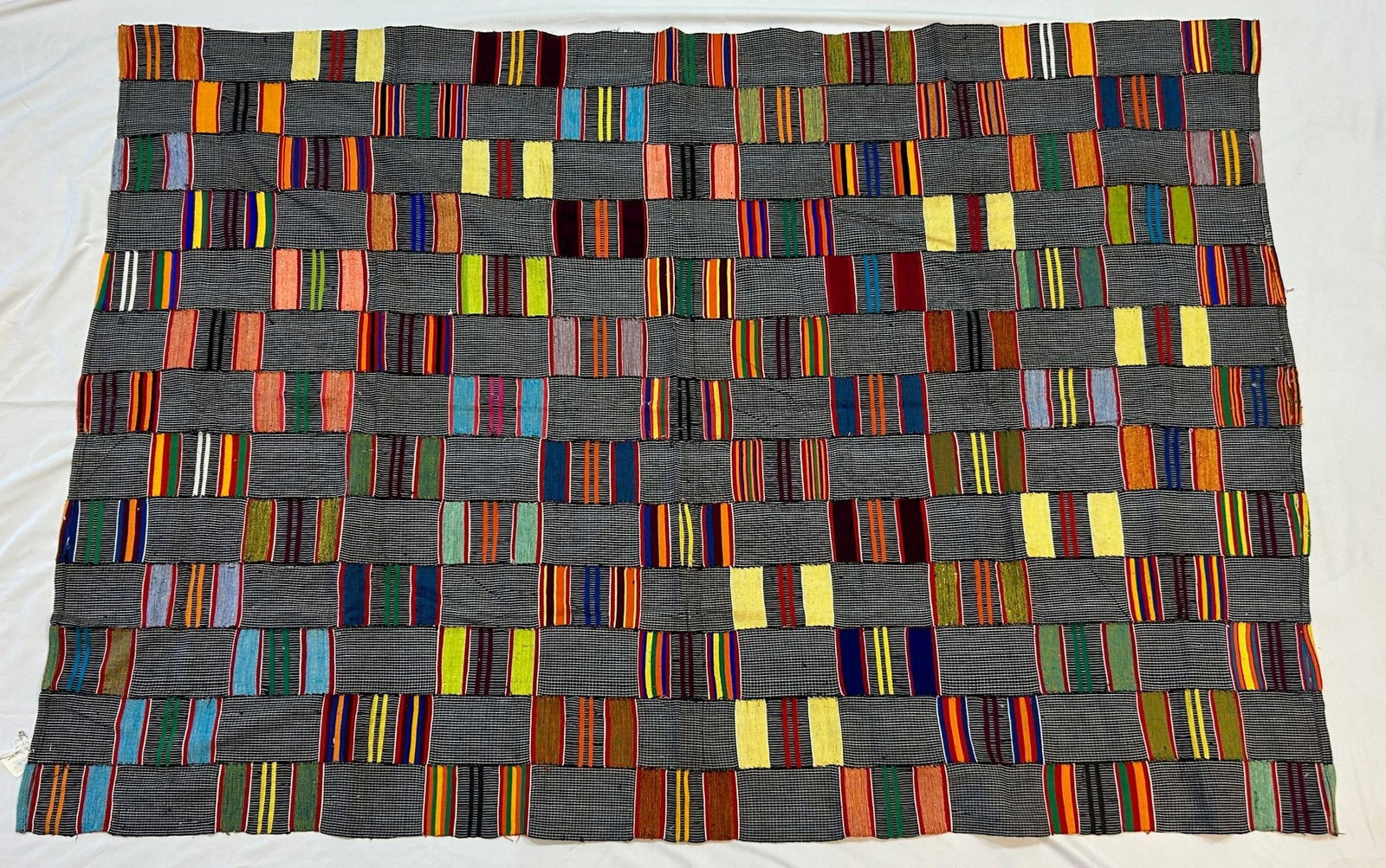 Ewe Peoples Kente Woven Textile: Kente woven textile, Ewe people, Togo, Africa. Likely mid-20th century. Approximate size, 69" x 49" PROVENANCE: From the estate of Dr. Philip Gould, New York