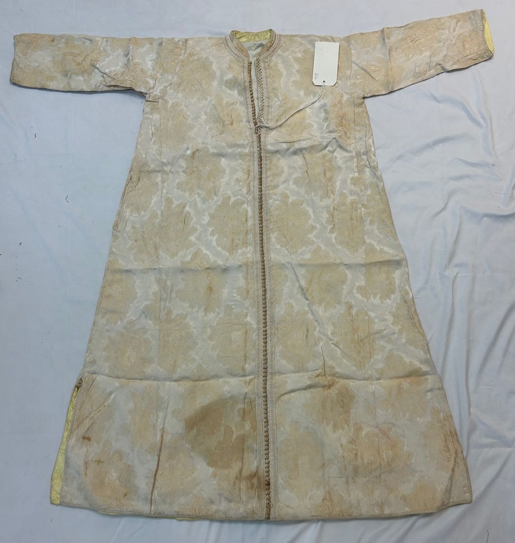 Morocco Of Classic Form With Brocade FabricFabric F Thelkaftann N: Morocco, North Africa, kaftan, of classic form with brocade fabric, first half of the 20th century, 53" x 50" PROVENANCE: From the estate of Dr. Philip Gould, New York