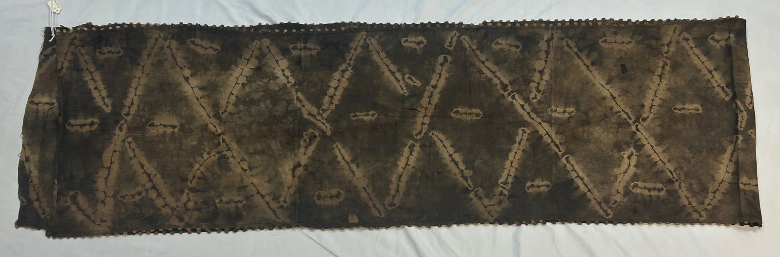 Kuba peoples, Tie-dye Skirt: Kuba peoples, Democratic Republic of the Congo, Central Africa, skirt with tie-dyed motif, likely mid-20th century. 23" x 144" PROVENANCE: From the estate of Dr. Philip Gould, New York
