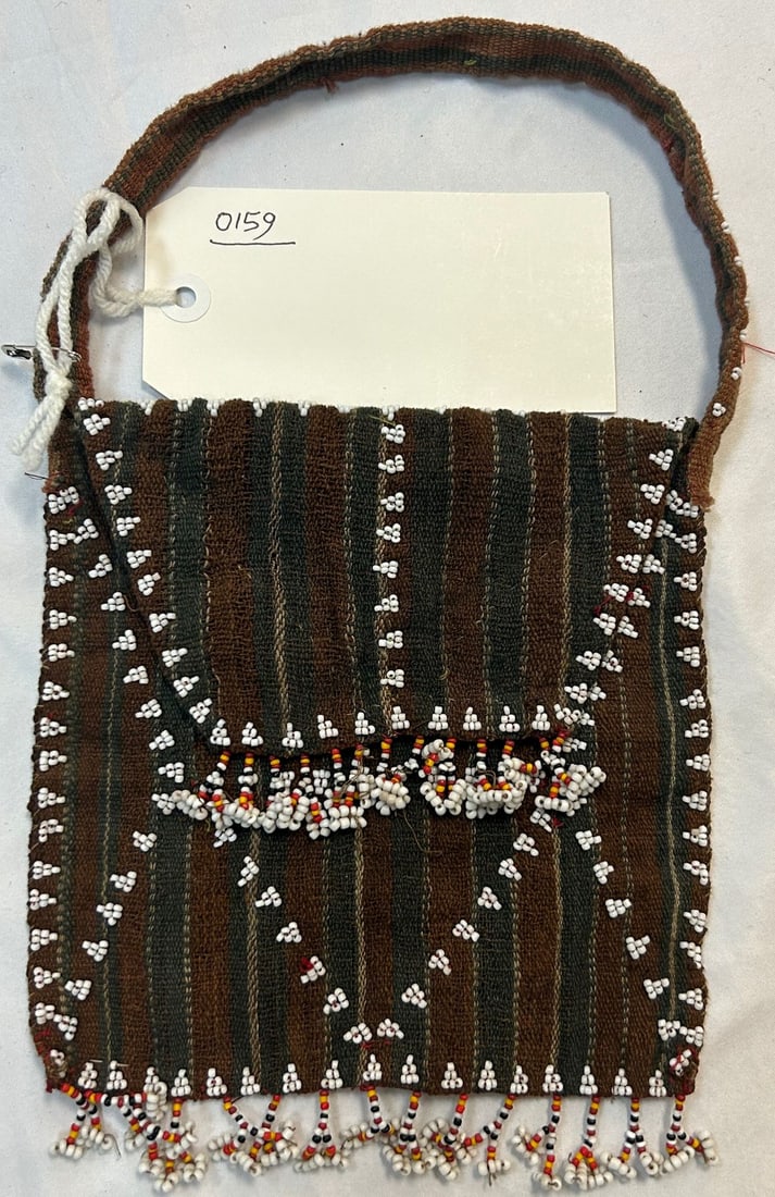 Small Bag Bead Decoration: Small textile bag, bead decoration, believed to be North Africa, likely mid-20th century. Approximate size, 7" x 7" (plus handle). PROVENANCE: From the estate of Dr. Philip Gould, New York
