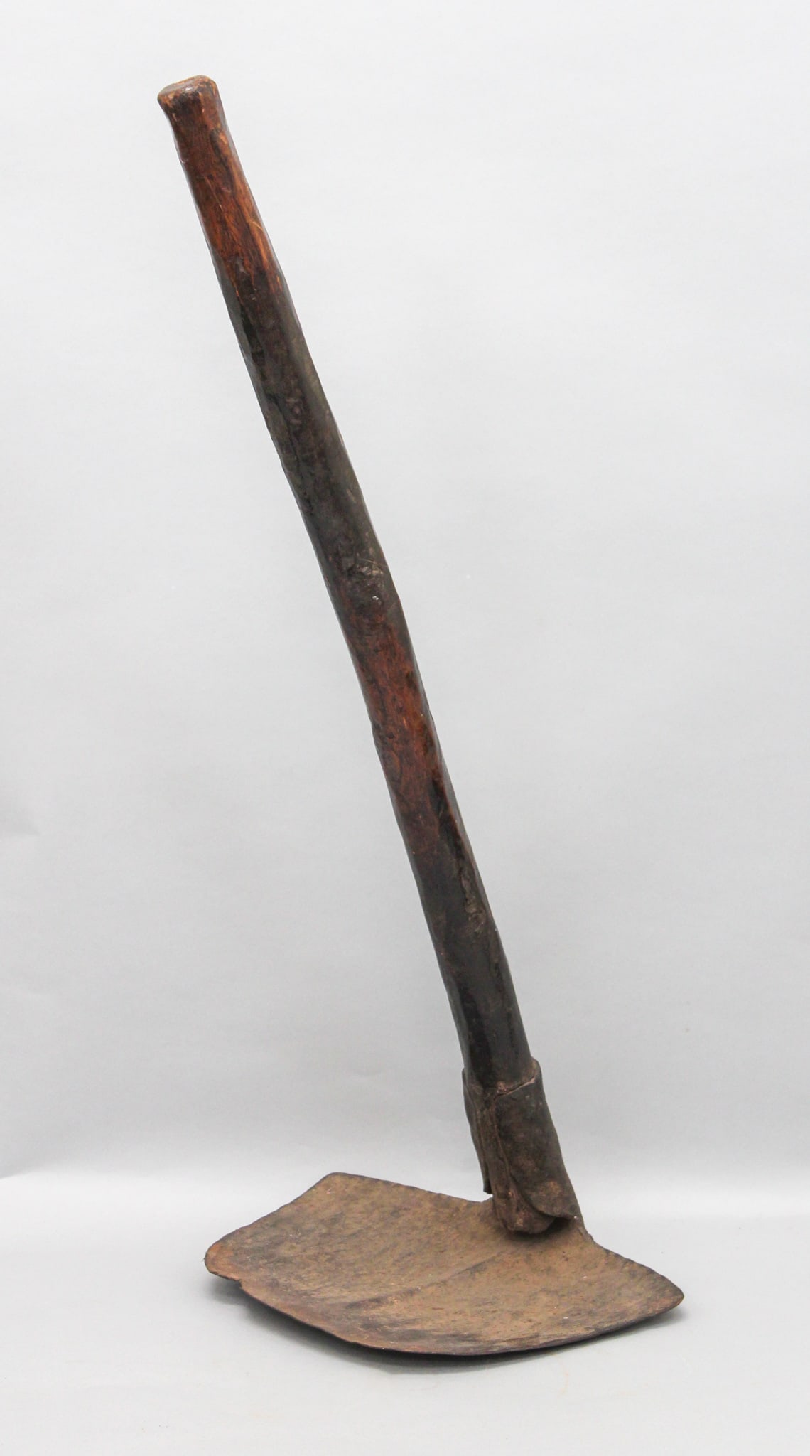 Large Hoe, Iron and Wood, Possibly a Currency Form, West African: Large hoe, iron and wood, possibly a currency form, West African, likely 19th century or early 20th century. Approximate size, blade 10" x 12.75", handle length 33". PROVENANCE: From the estate of Dr.