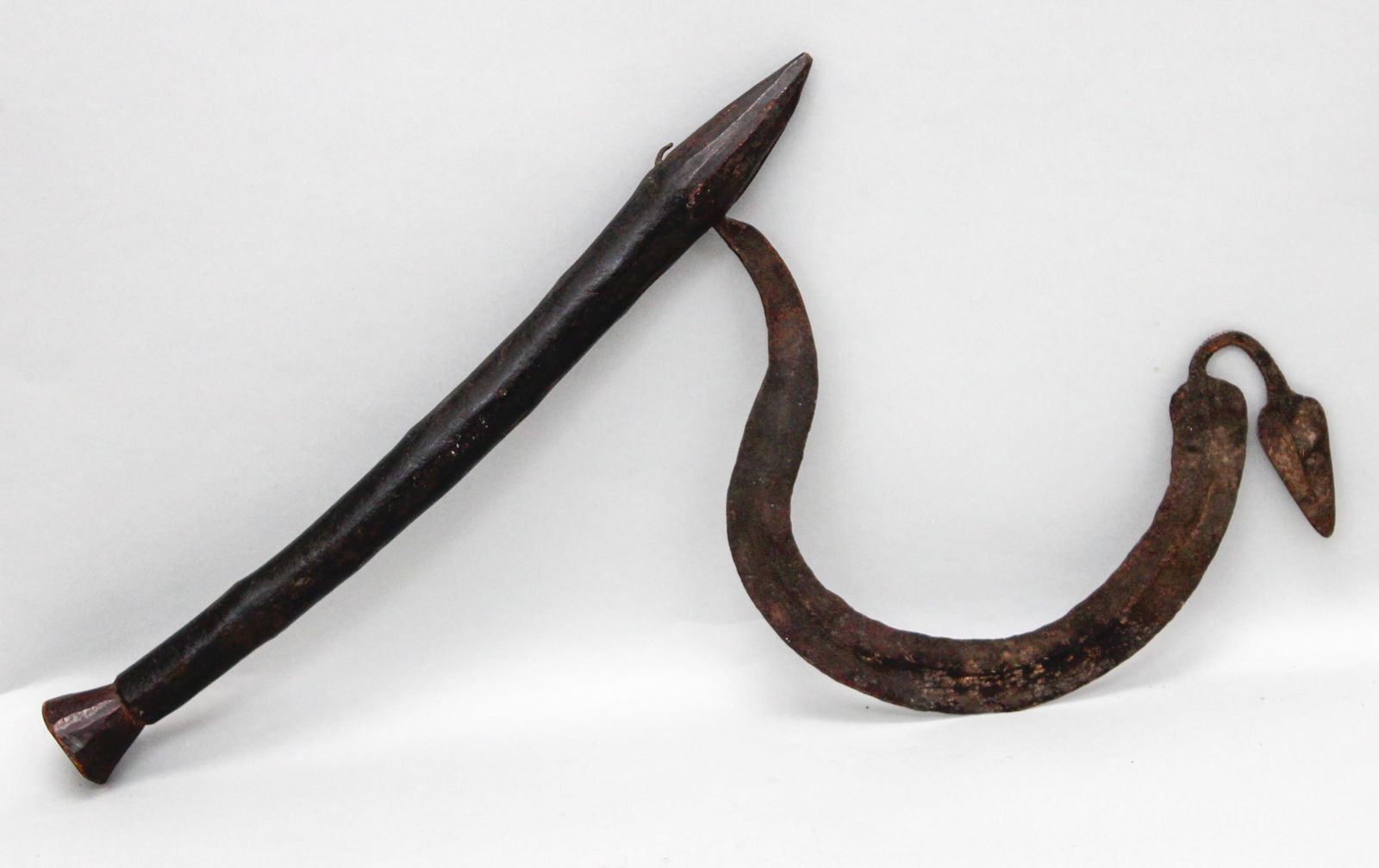 Wrought Iron Ceremonial Blade, Chamba peoples, West Africa,: Wrought iron ceremonial blade, wood handle, Chamba peoples, West Africa, likely 19th century or early 20th century.Approximate size, 17"H x 12" Diameter. Exhibited, "Iron Clad, Fancy Free: Exhibition