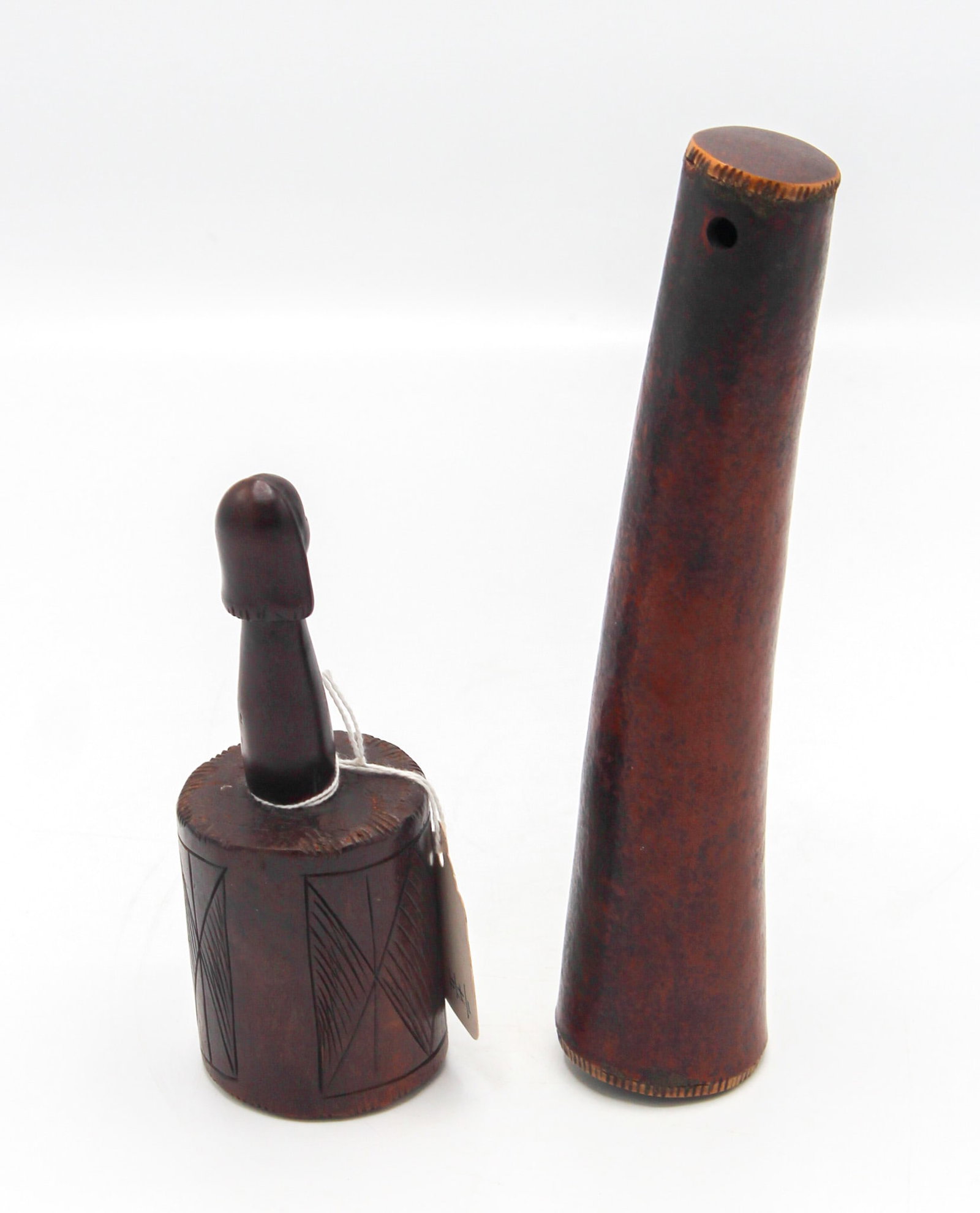 Group of (2) Rattles: Fang Style, Carved Wood with Ancaster Head and a Tubular Carved Wood Rattle: Group of (2) rattles: Fang style, carved wood with ancestor head, Gabonese Republic, Central Africa, and a tubular carved wood rattle, unknown culture, 20th century. Approximate size 8"H (larger) and 
