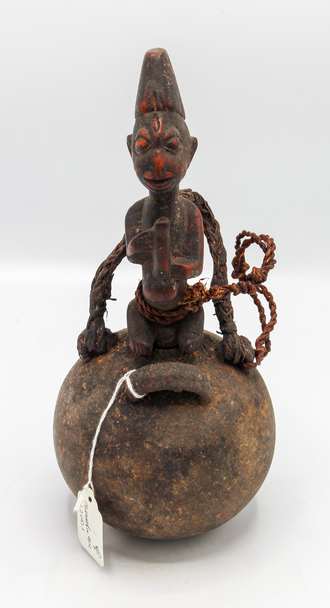 Yoruba People Style, Carved Wood, Natural Fiber, Nigeria, West Africa: Yoruba people style, carved wood, natural fiber, Nigeria, West Africa, 20th century. Approximate size, 11"H. PROVENANCE: From the estate of Dr. Philip Gould, New York