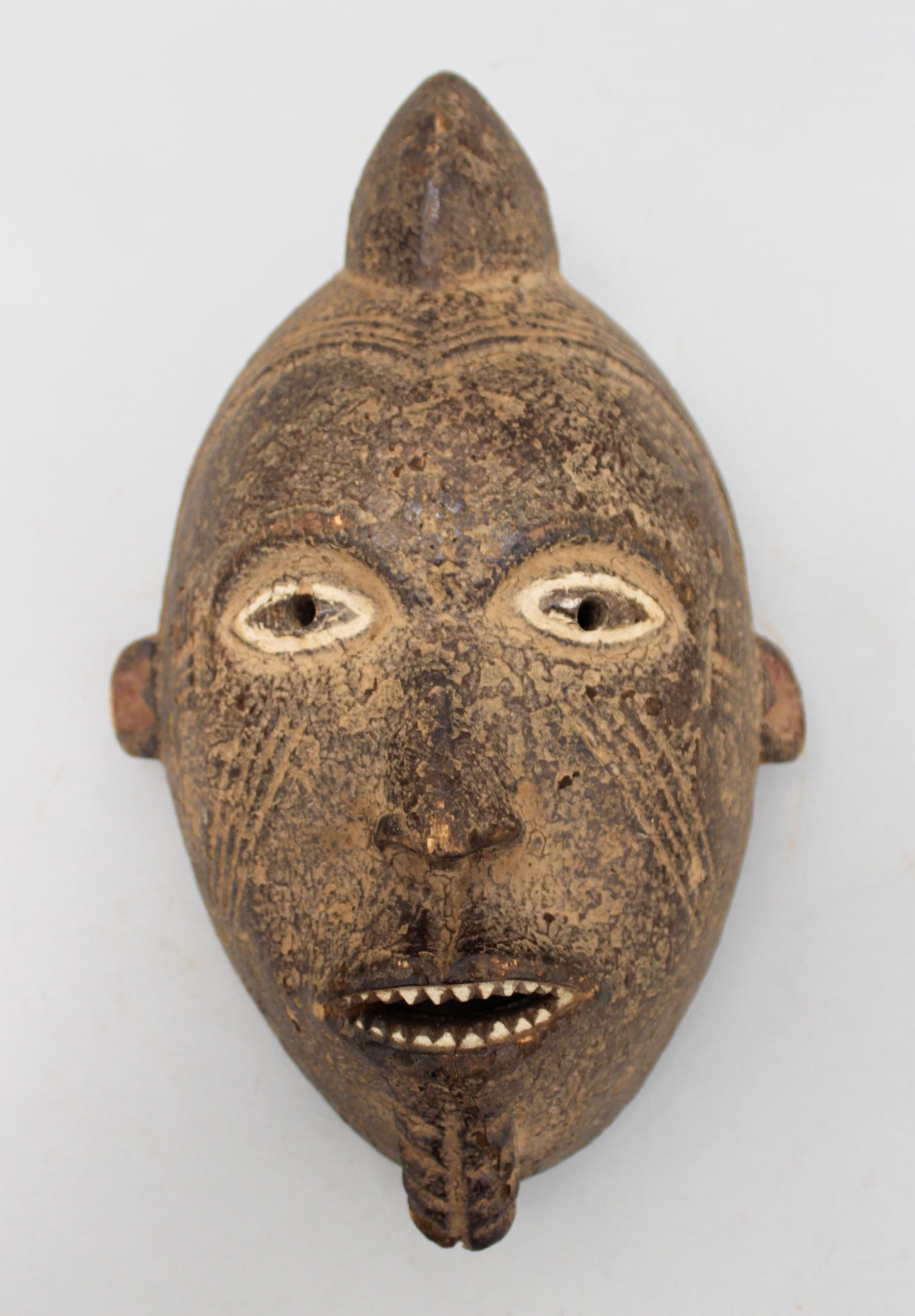 Nigerian Style, Carved Wood Mask, West Africa: Nigerian style carved wood mask, West Africa, 20th century. Approximate size, 10.9"H. PROVENANCE: From the estate of Dr. Philip Gould, New York