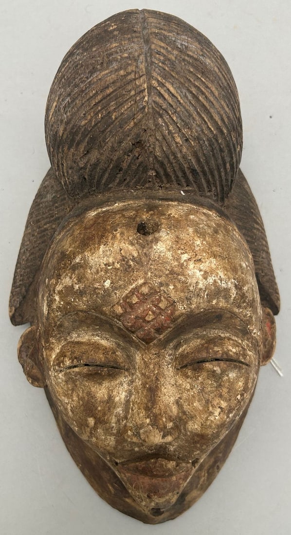 Punu People Style, Carved Wood Mask, Gabonese Republic, Central Africa: Punu people style, carved wood mask, Gabonese Republic, Central Africa, 20th century. Approximate size, 11.2"H. PROVENANCE: From the estate of Dr. Philip Gould, New York