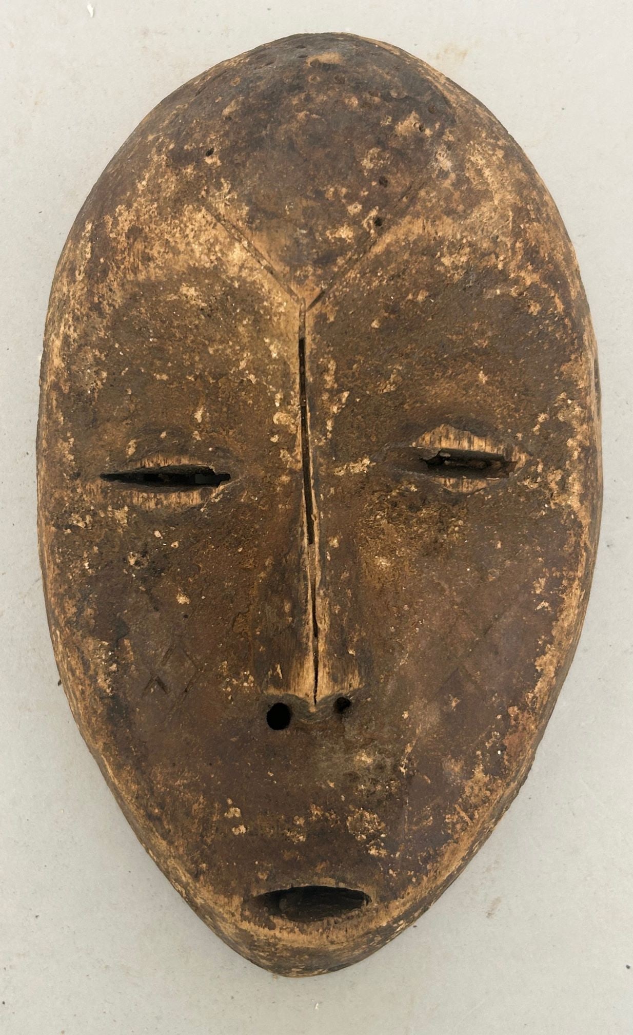 Lega Peoples Style, Carved Wood Mask, Democratic Republic of the Congo, Central Africa: Lega peoples style carved wood mask, Democratic Republic of the Congo, Central Africa, 20th century. Approximate size, 10"H. PROVENANCE: From the estate of Dr. Philip Gould, New York