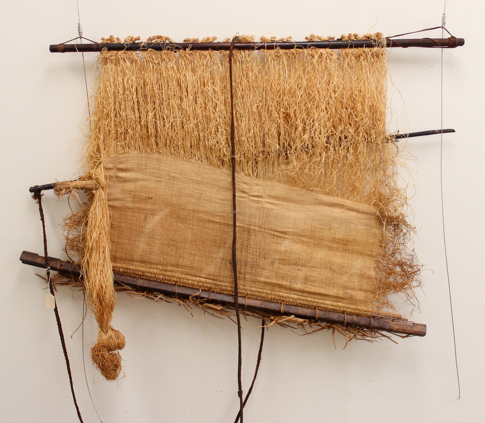 Kuba peoples, Loom with Partly Completed Raffia Weaving, Democratic Republic of the Congo, Central: Kuba peoples, loom with partly completed raffia weaving, Democratic Republic of the Congo, Central Africa, 20th century.Approximate size, 32"h x 44"W. PROVENANCE: From the estate of Dr. Philip Gould, 