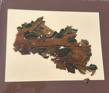 3rd - 10th Century Coptic Textile Fragment, Egypt, North Africa: 3rd - 10th Century Coptic textile fragment, with tree and leaf design, Egypt, North Africa. Approximate size 13"H x 9.5"W, with a mat with outside dimensions 20"H x 16"W. PROVENANCE: From the estate o