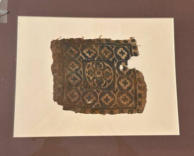 3rd - 10th Century Coptic Textile Fragment, Egypt, North Africa: 3rd - 10th Century Coptic textile fragment, central medallion surrounded by twelve cross motif’s, Egypt, North Africa. Approximate size 9"H x 7.5"W, with a mat with outside dimensions 20"H x 16"W.