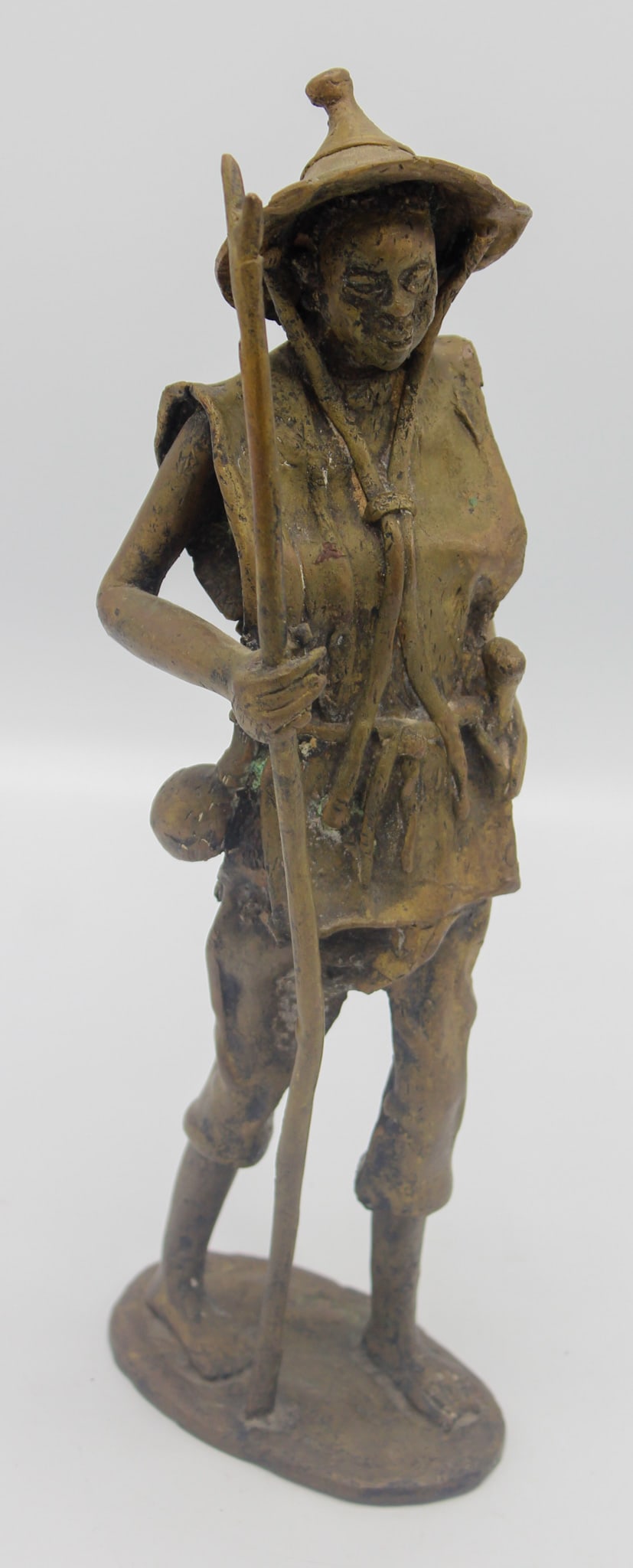 Cast Bronze "Nigerian Fulani Cattle Herder" by Derme Morou (1940-2000): Cast bronze "Nigerian Fulani Cattle Herder", mark on bottom Derme Morou BP 5075, 12"h x 3"w x 4.25 d