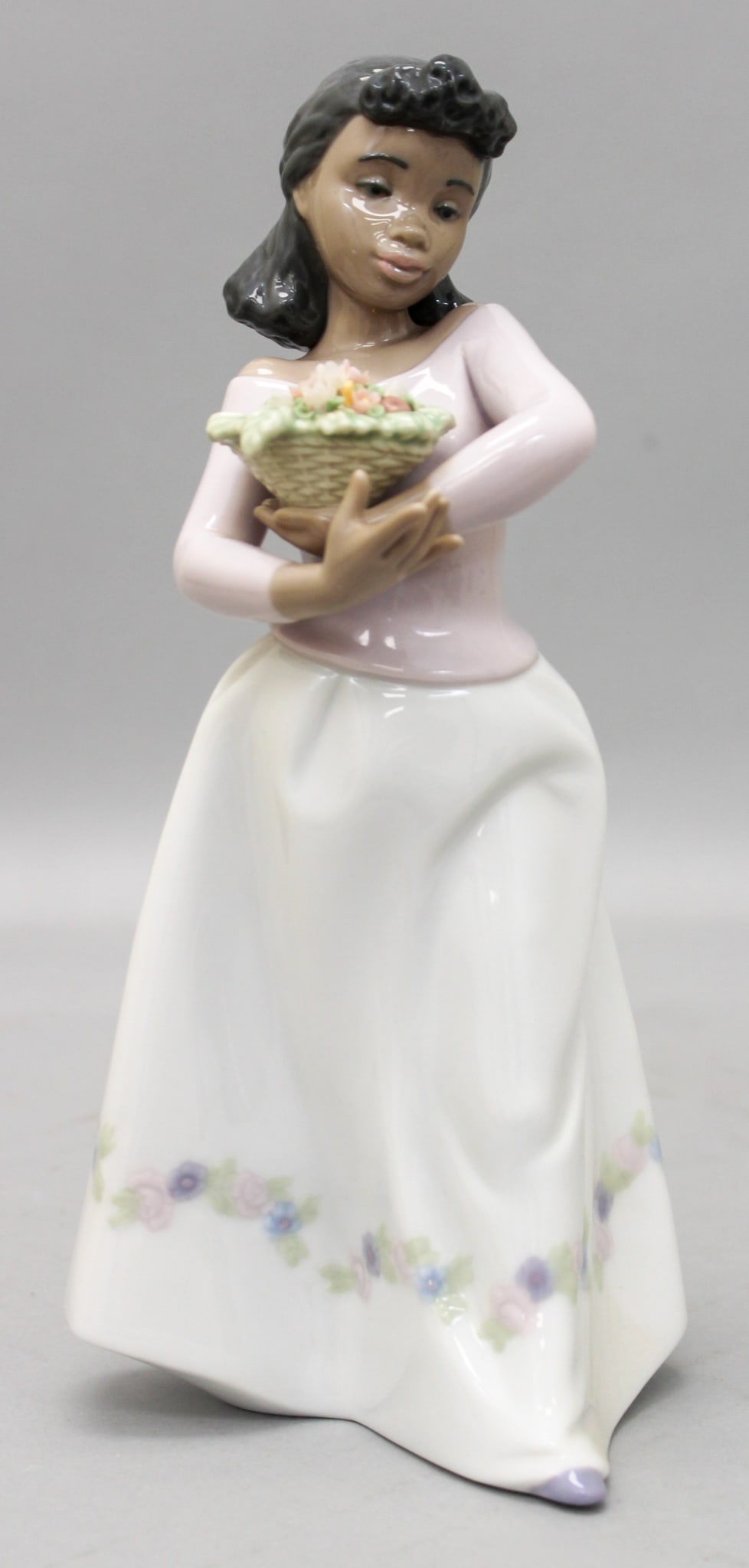 Lladro "Delicate Bundle" 6167 Black Legacy Figurine: Lladro "Delicate Bundle" 6167 Black Legacy figurine, mark on bottom Lladro, Hand Made in Spain, Daisa 1994, 6167, E-28-J, 9.75"h x 5.5"w x 5"d in box 6"h x 11"w x 6"d