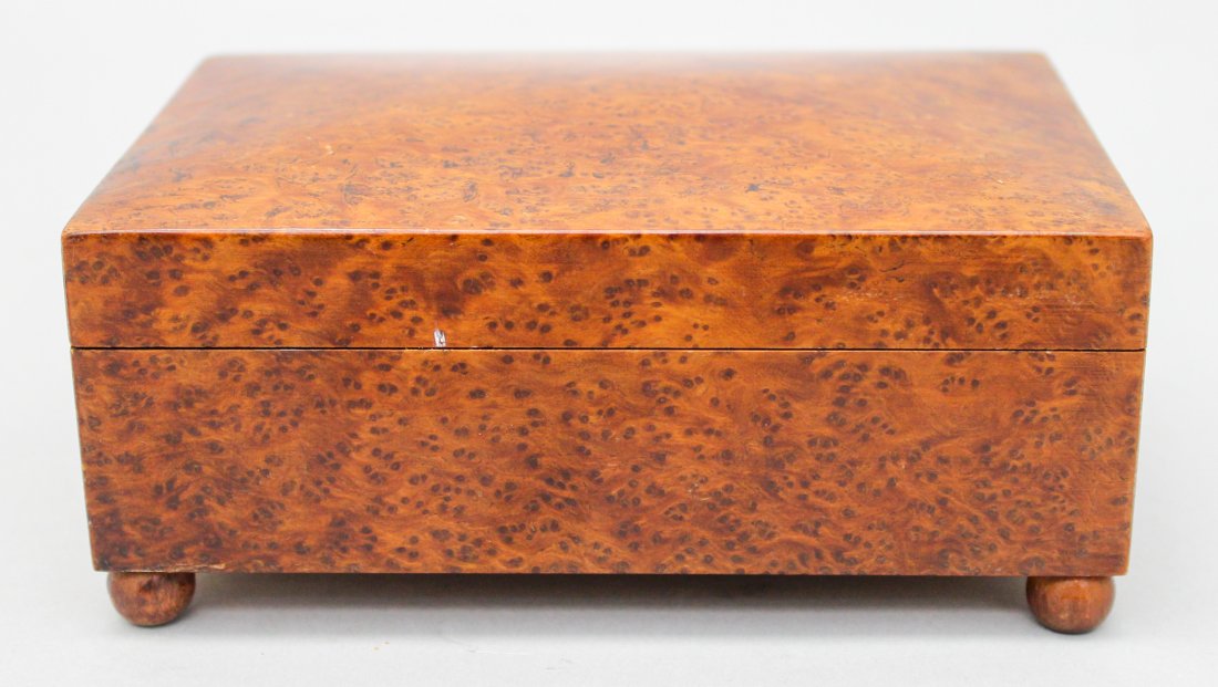 Vintage Swiss Music Box with Burl Wood Veneer: Vintage music box with burl wood veneer, marked "Made in Suitzerland" on bottom, 2.5"h x 6"w x 4"d