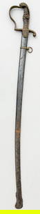Antique WWI German Artillery Officier's Lion Head Sword: Antique German Artillery Officier's Lion Head Sword with engraved blade, fishskin grip with brass wire, brass wilt badge, black painted steel scabbard with single hanger, sheath size 33.75"l and sword