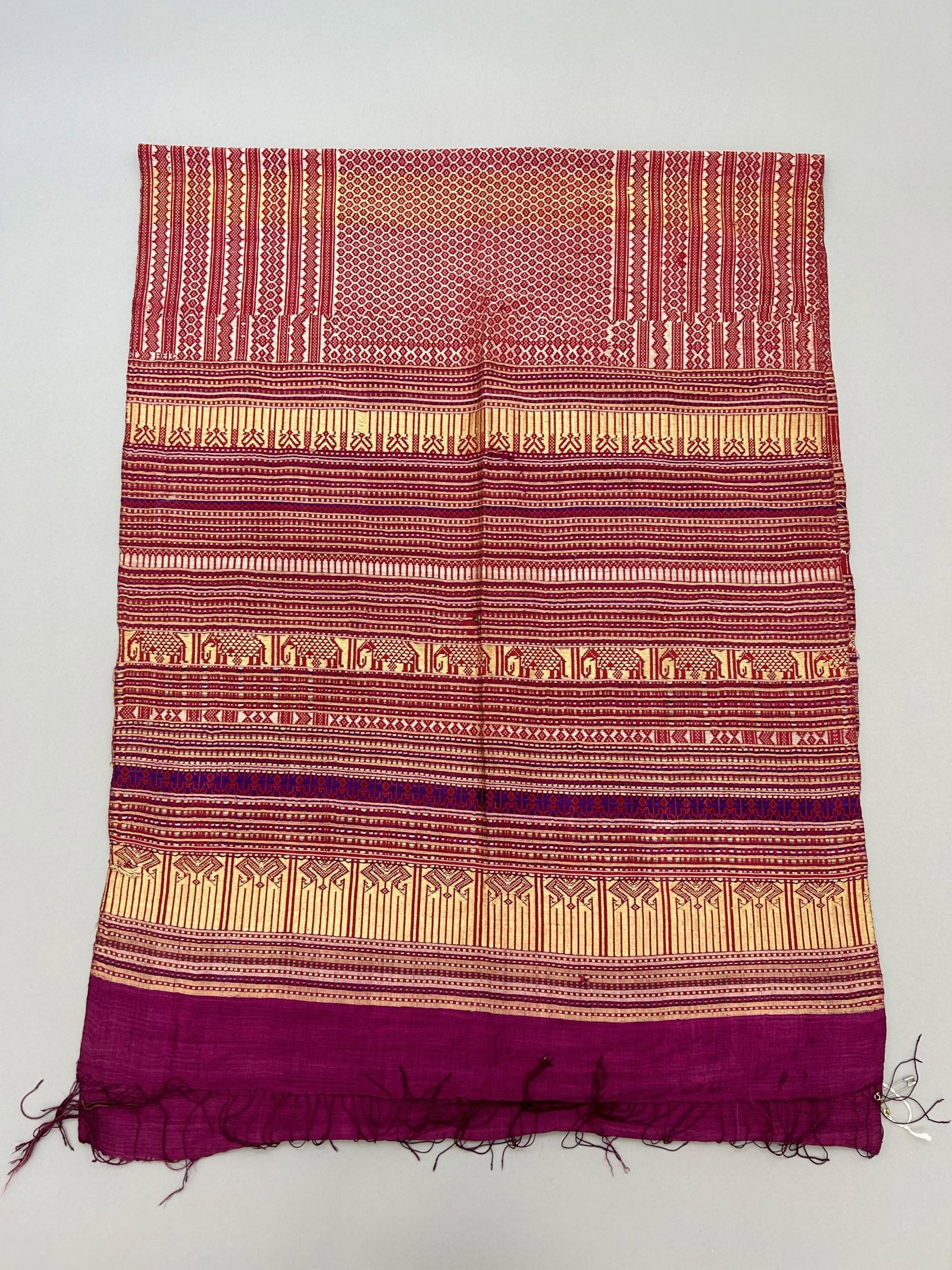 Laos, Handwoven Silk Salendang: Laos, handwoven silk "Salendang" shoulder cloth, 68"l X 25"w (78"l X 18"w with fringes) Provenance: From the estate of Dr. Philip Gould , New York