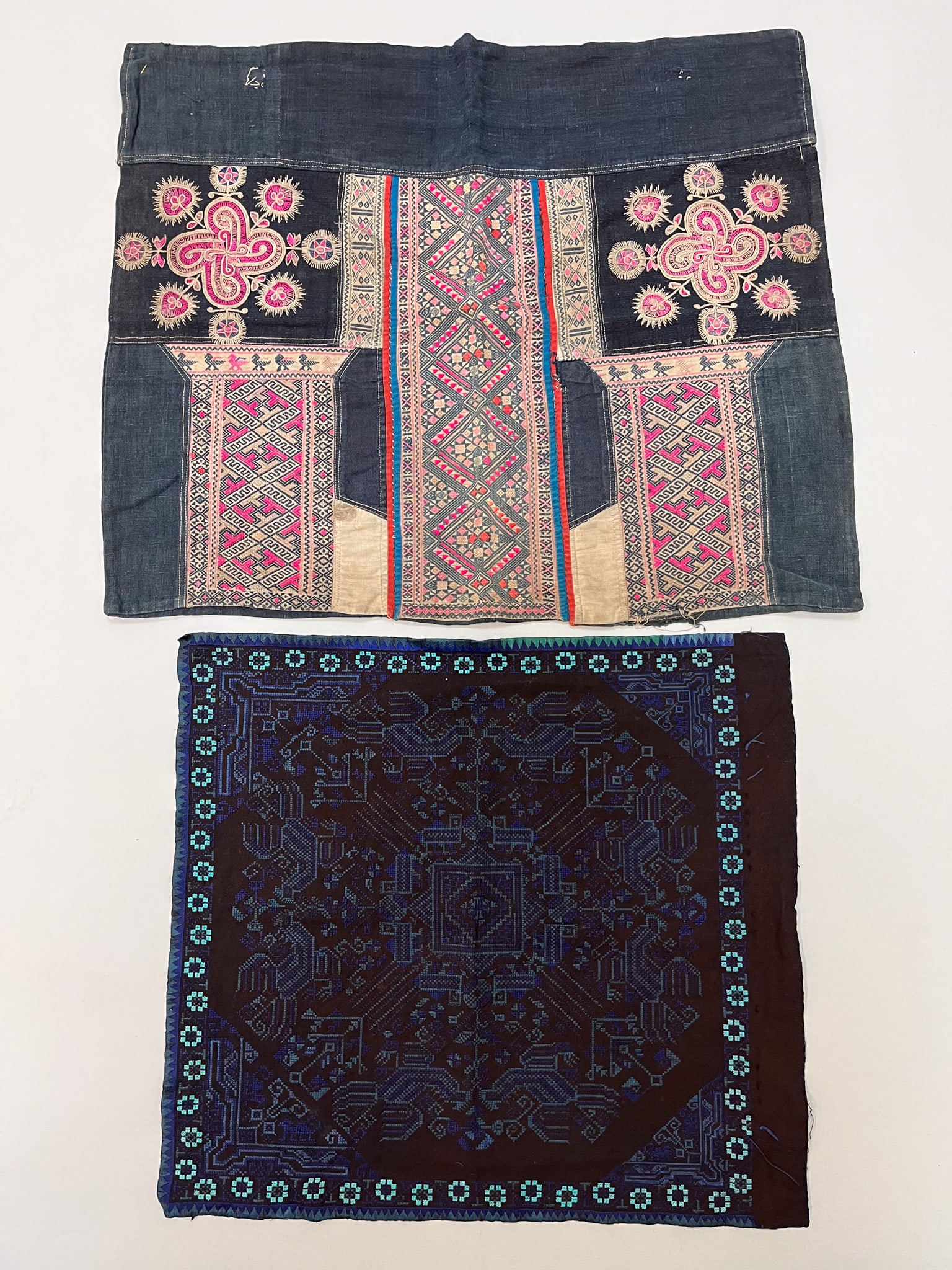 Miao, Yunnan Province, Southern China, Group of (2) Vintage Cotton Embroidery Accessories: Miao, Yunnan Province, Southern China, group of (2) vintage cotton embroidery accessories, black ground with multicolor traditional tribal pattern, 18"l x 22"w, 16"l x 18"w Provenance: From the estate