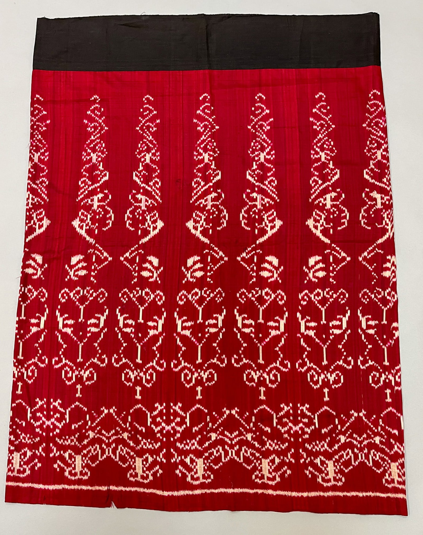 Myanmar (Burma), Vintage Silk Ikat Pattern Tubular Sarong: Myanmar (Burma), vintage silk ikat pattern tubular sarong, red ground with white traditional pattern, 43"l x 32"w Provenance: From the estate of Dr. Philip Gould , New York