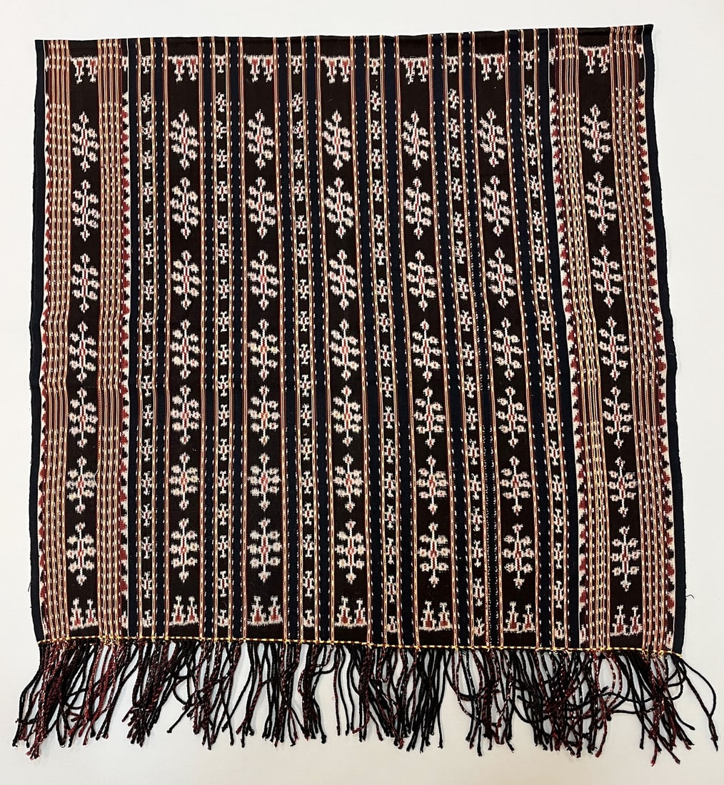 Sawu, Indonesia, Vintage Woven Ikat Sarong: Sawu, Indonesia, vintage woven ikat sarong, indigo ground with rust, yellow stripe and traditional pattern, 60"l x 30"w Provenance: From the estate of Dr. Philip Gould , New York