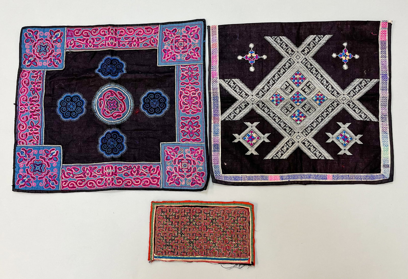 Miao, Yunnan Province, Southern China, Group of (3) Vintage Cotton Embroidery Accessories: Miao, Yunnan Province, Southern China, group of (3) vintage cotton embroidery accessories, 15"l x 17"w, 14"lx 15"w, 9"l x 5"w Provenance: From the estate of Dr. Philip Gould , New York