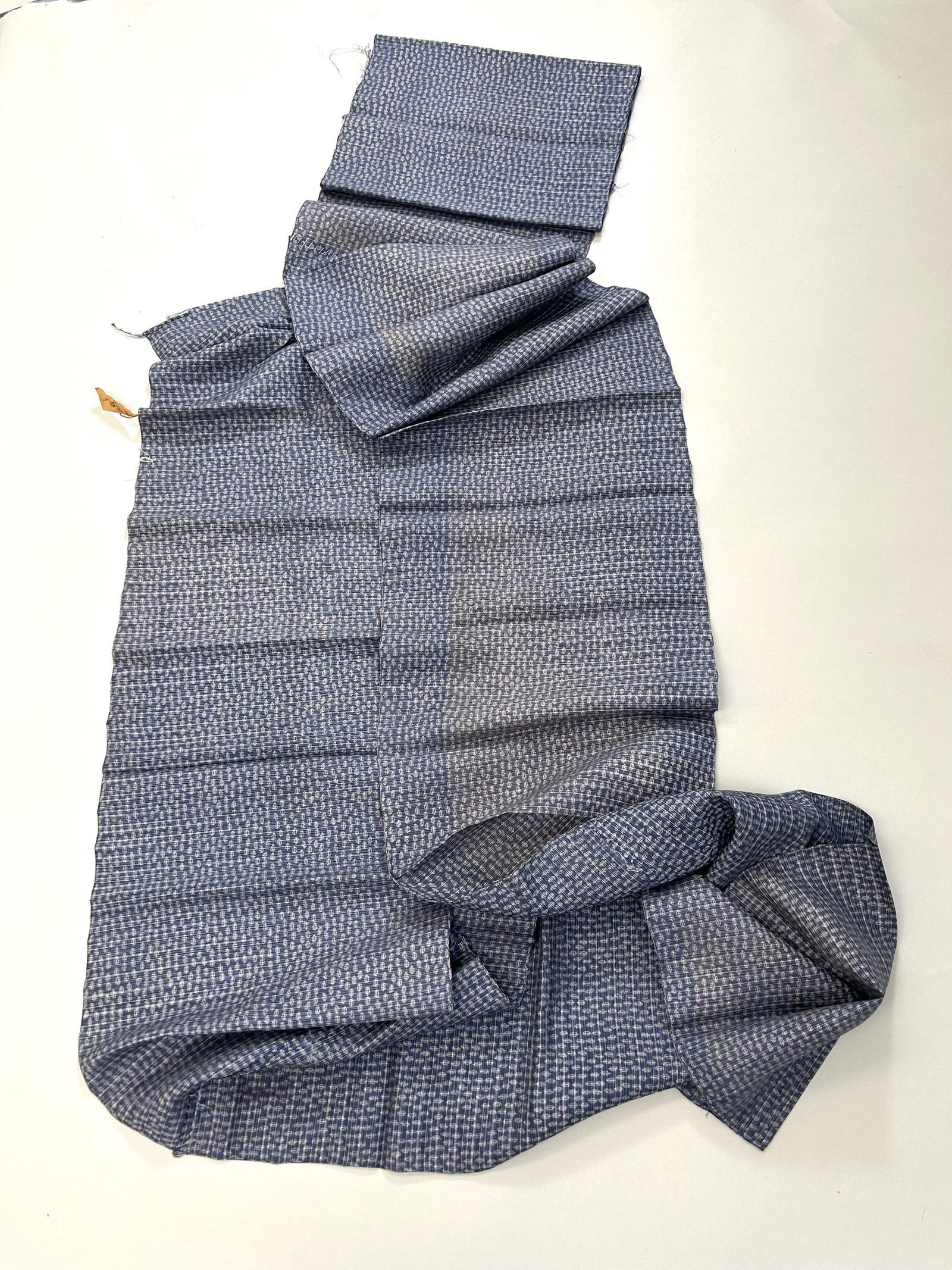 Japanese Gomi Kasuri Hemp Cloth: Japanese Gomi Kasuri Silk Hemp Cloth, approximately size 400"l x 13.5"w Provenance: From the estate of Dr. Philip Gould , New York