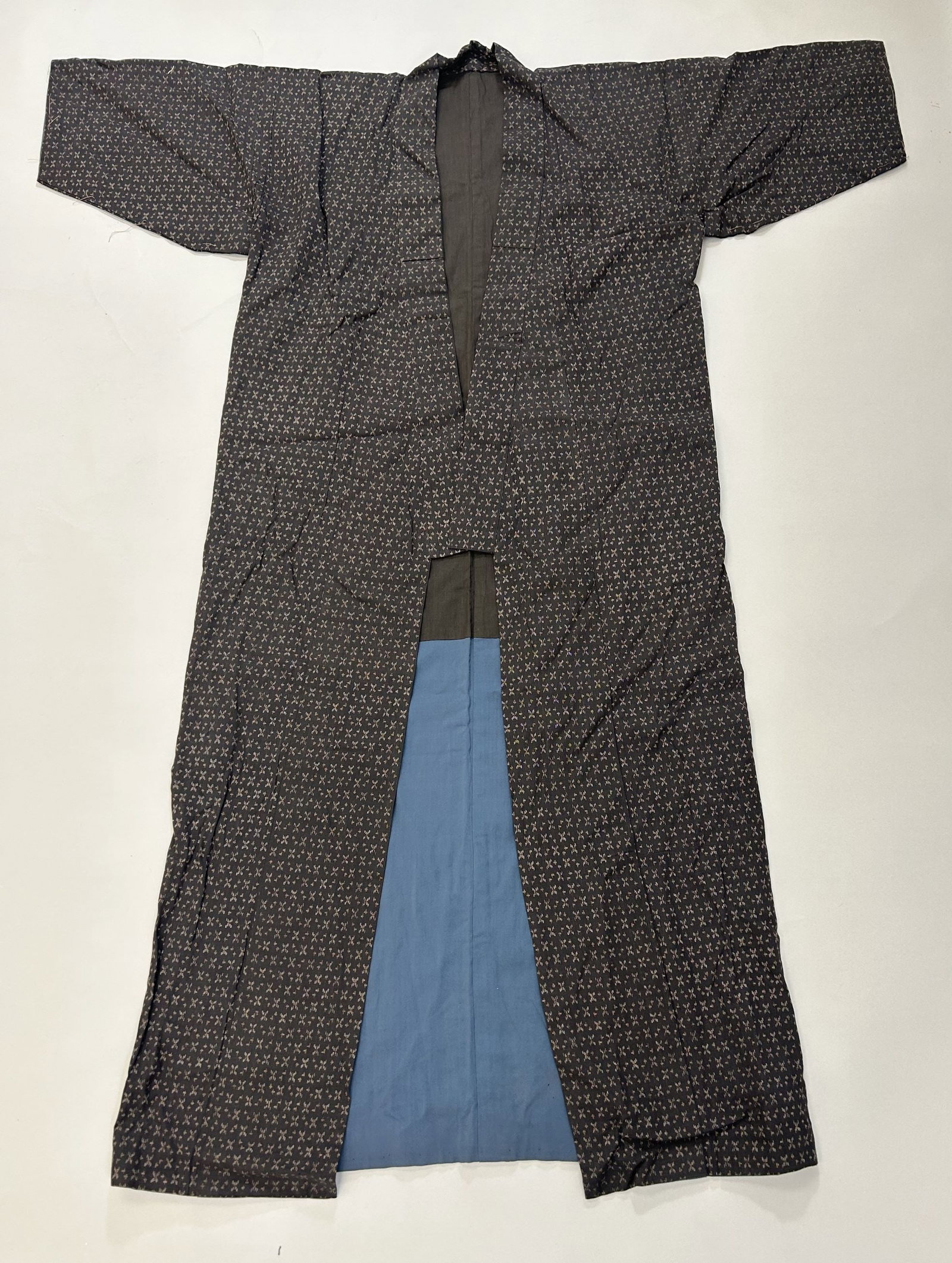 Japanese Indigo Kasuri Silk Kimono: Japanese Indigo Kasuri Silk Kimono, 57' x 47"w x 46'' shoulder length x 11'' sleeve length Provenance: From the estate of Dr. Philip Gould , New York