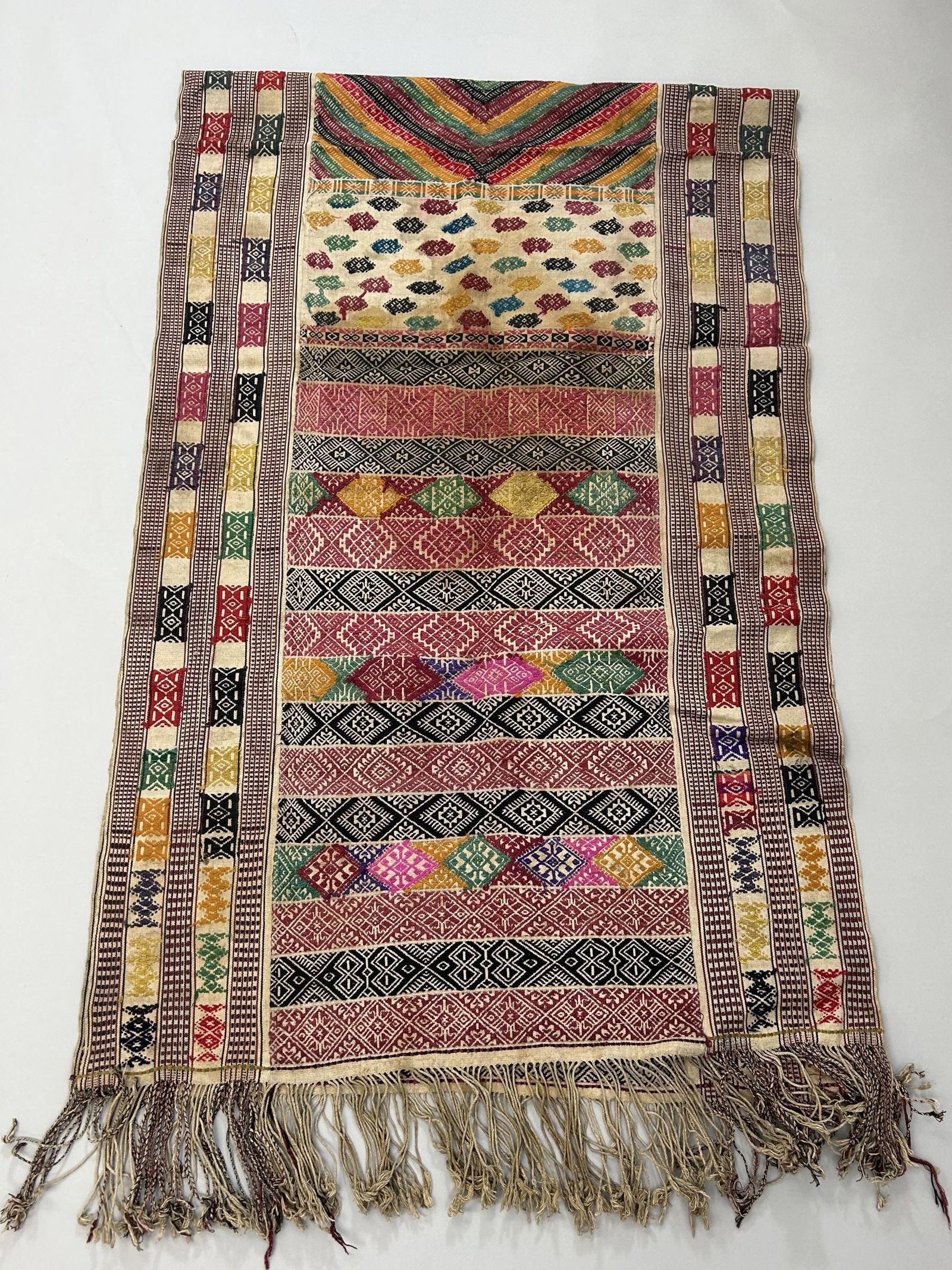 Bhutan Handwoven Embroidered Cotton Textile: Bhutan Handwoven Embroidered Cotton Textile, 96"l x 32"w (106''l with fringes) Provenance: From the estate of Dr. Philip Gould , New York