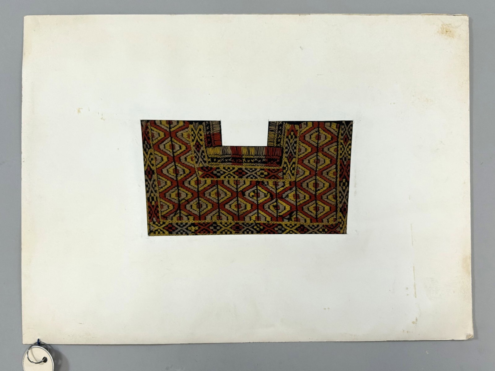 Taiwan Aboriginal Embroidered Matted Textile Fragment: Taiwan Aboriginal Embroidered Textile Fragment, possibly matted for exhibition, approximately 7.5"l x 5"w Provenance: From the estate of Dr. Philip Gould , New York