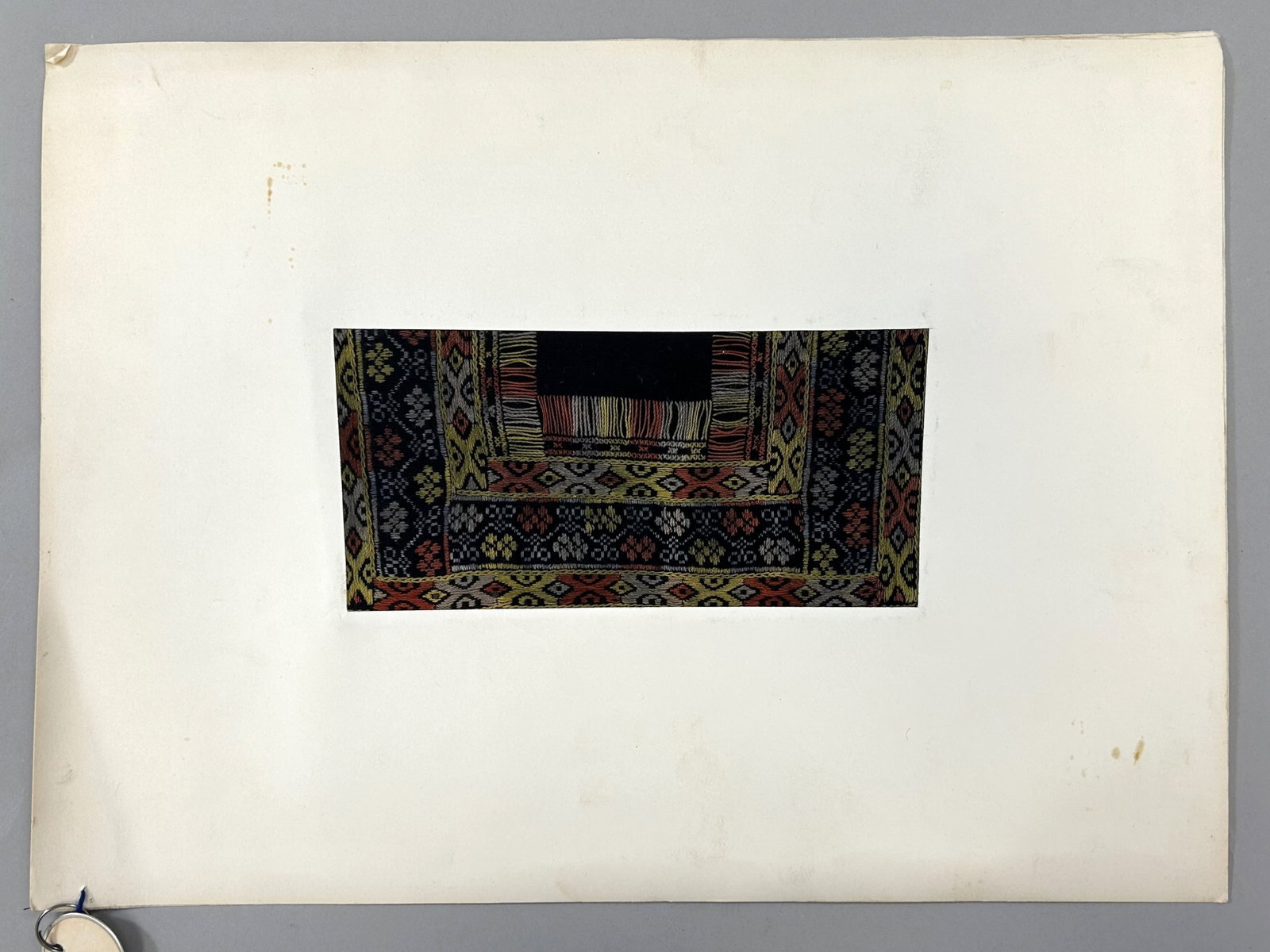 Taiwan Aboriginal Embroidered Matted Textile Fragment: Taiwan Aboriginal Embroidered Textile Fragment, possibly matted for exhibition, approximately 8"l x 4"w Provenance: From the estate of Dr. Philip Gould , New York