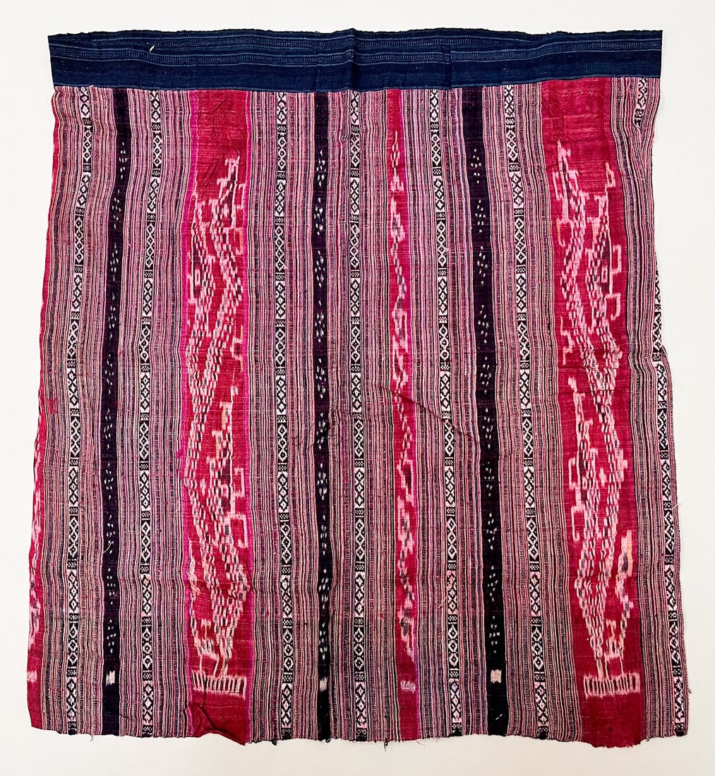 Possibly Tai Daeng, Laos, Vintage Cotton and Silk "Sinh" Tubular Sarong: Possibly Tai Daeng, Laos, vintage cotton and silk "Sinh" tubular sarong, ikat and silk thread embroidery traditional pattern in pink tones color stripes, 27"l x 24"w Provenance: From the estate of Dr.