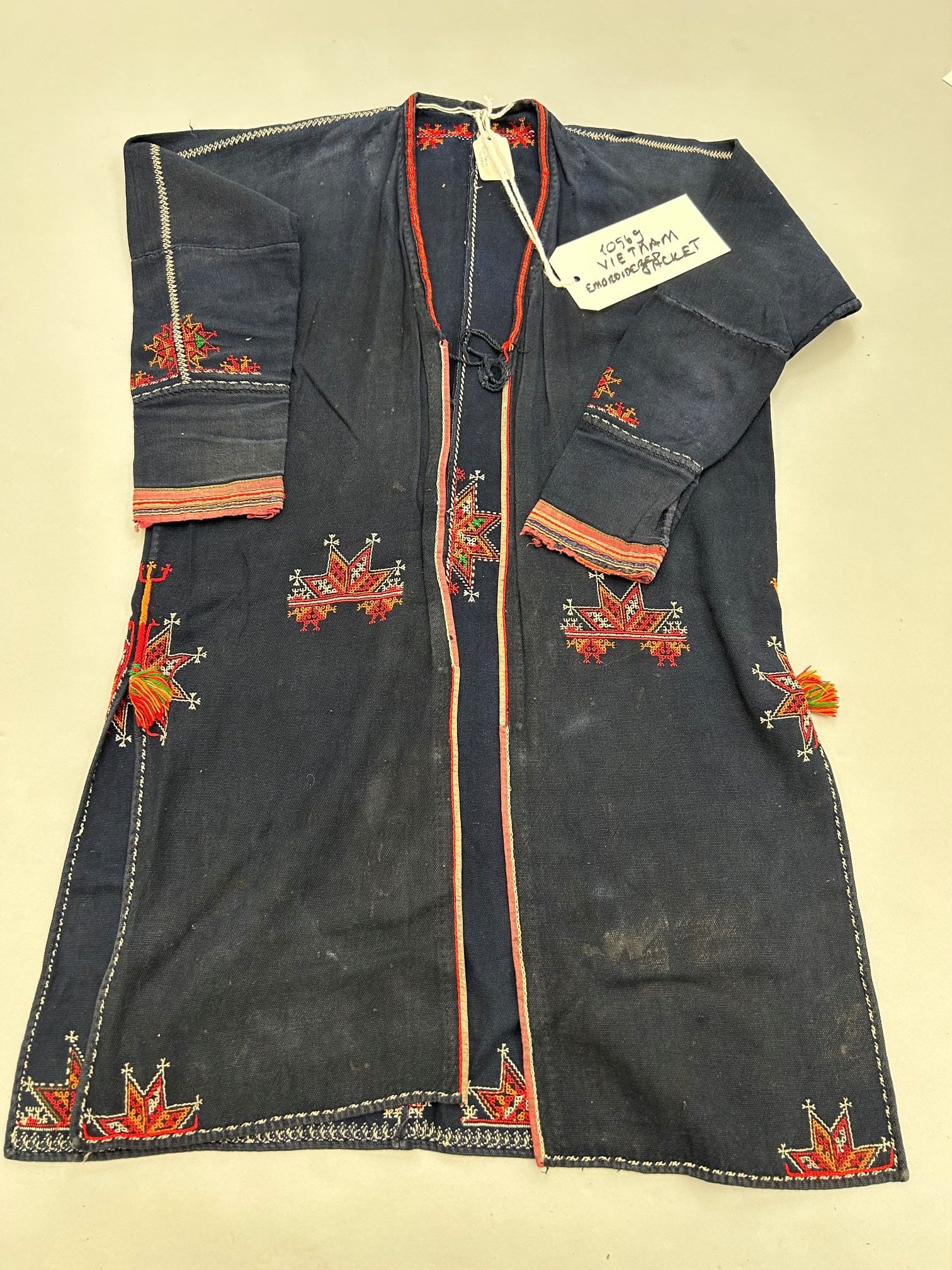 Vietnam, Embroidered Tribal Jacket: Vietnam, embroidered tribal jacket, 30"l x 36"w x shoulder 15" w Provenance: From the estate of Dr. Philip Gould , New York