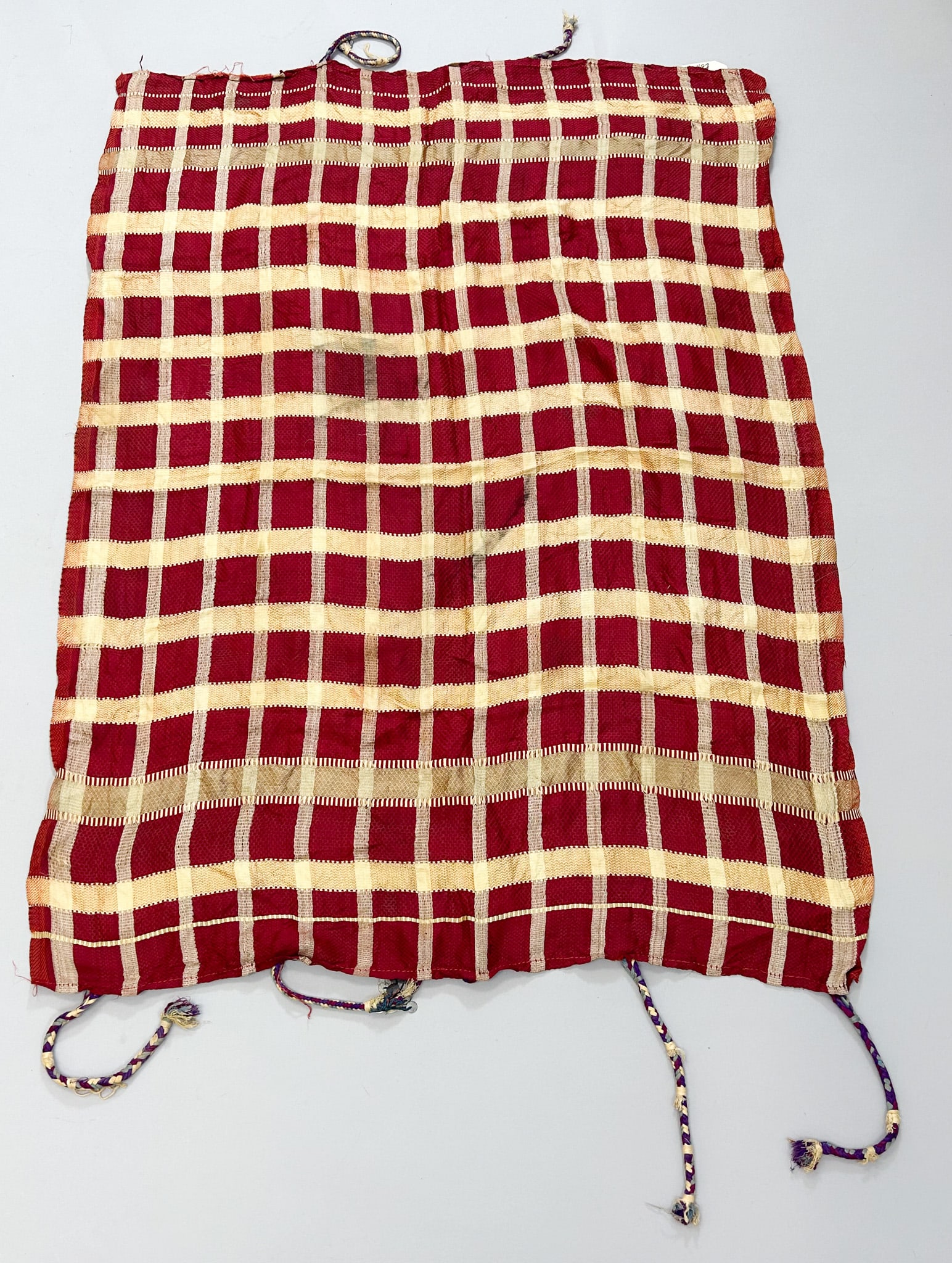 Egyptian Silk Textile: Egyptian silk textile, gold and red checkered design with edge tassles, North Africa, 41" x 30" PROVENANCE:From the estate of Professor Philip Gould, New York