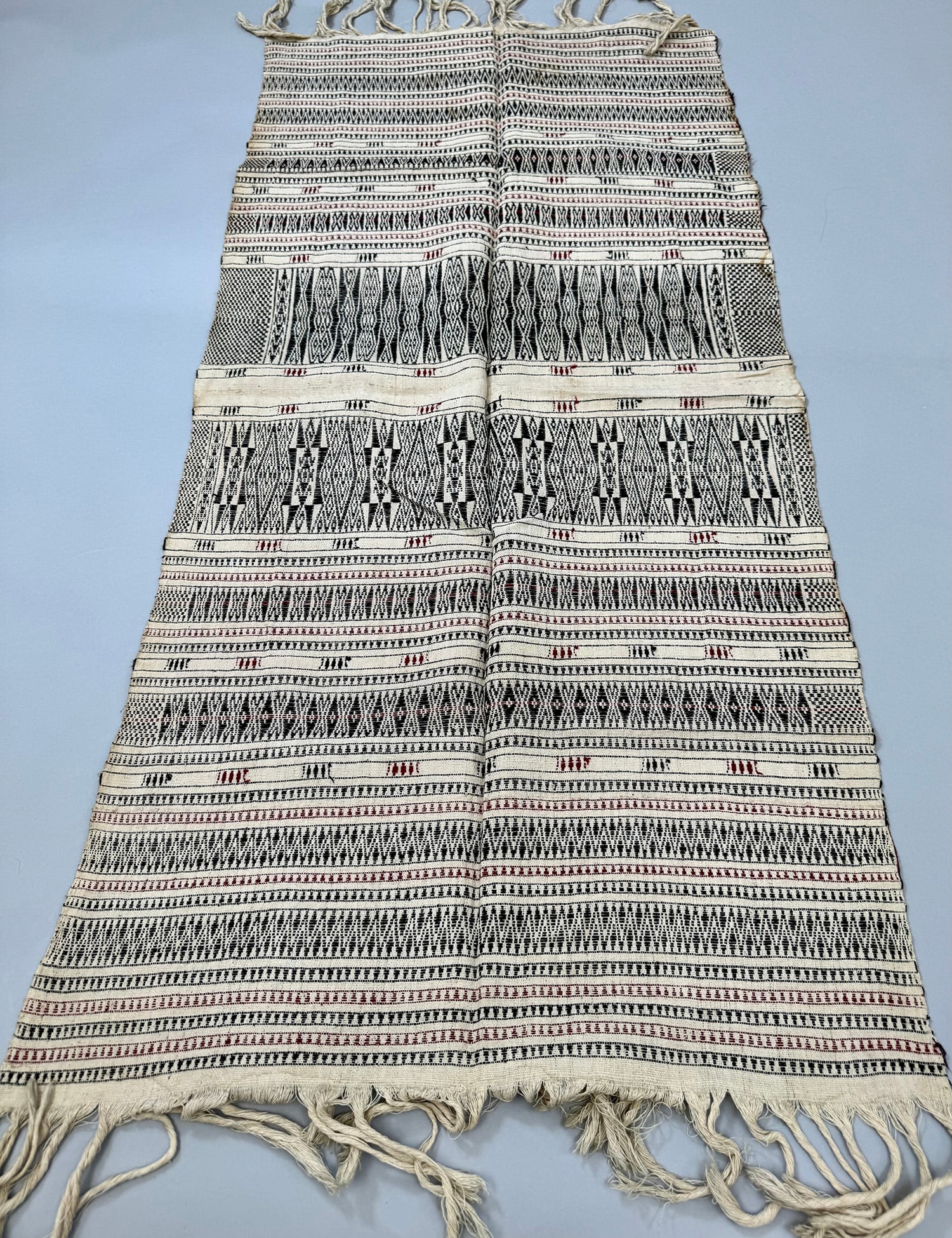 Possibly Bhutan, Woven Cotton Textile: Bhutan woven cotton textile. D: 50L x 20W in. PROVENANCE:From the estate of Professor Philip Gould, New York