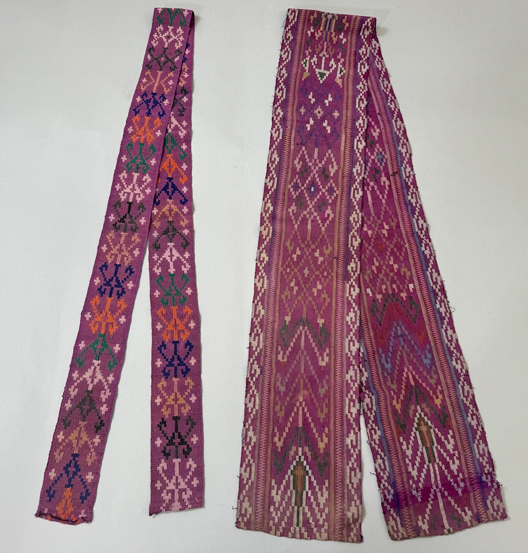 Possiblbly Indonesian or Bhutanese Asian Textile Belts - Set of 2: Asian purple textile belts. Large belt dimensions: 60L x 5.5W in. Small belt dimensions: 29L x 2.9W in. PROVENANCE:From the estate of Professor Philip Gould, New York