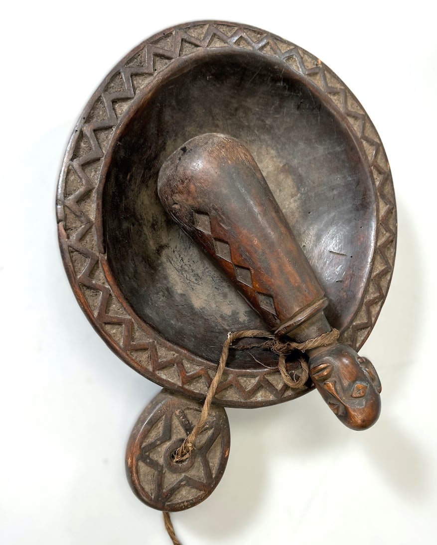 Wood Bowl With Figural Pestle: Carved wood bowl with figural pestle, unconfirmed African culture. Dimensions (approx.): 15" x 11" x 3" (bowl) and 10" x 3" diameter (pestle) PROVENANCE:From the estate of Professor Philip Gould, New 