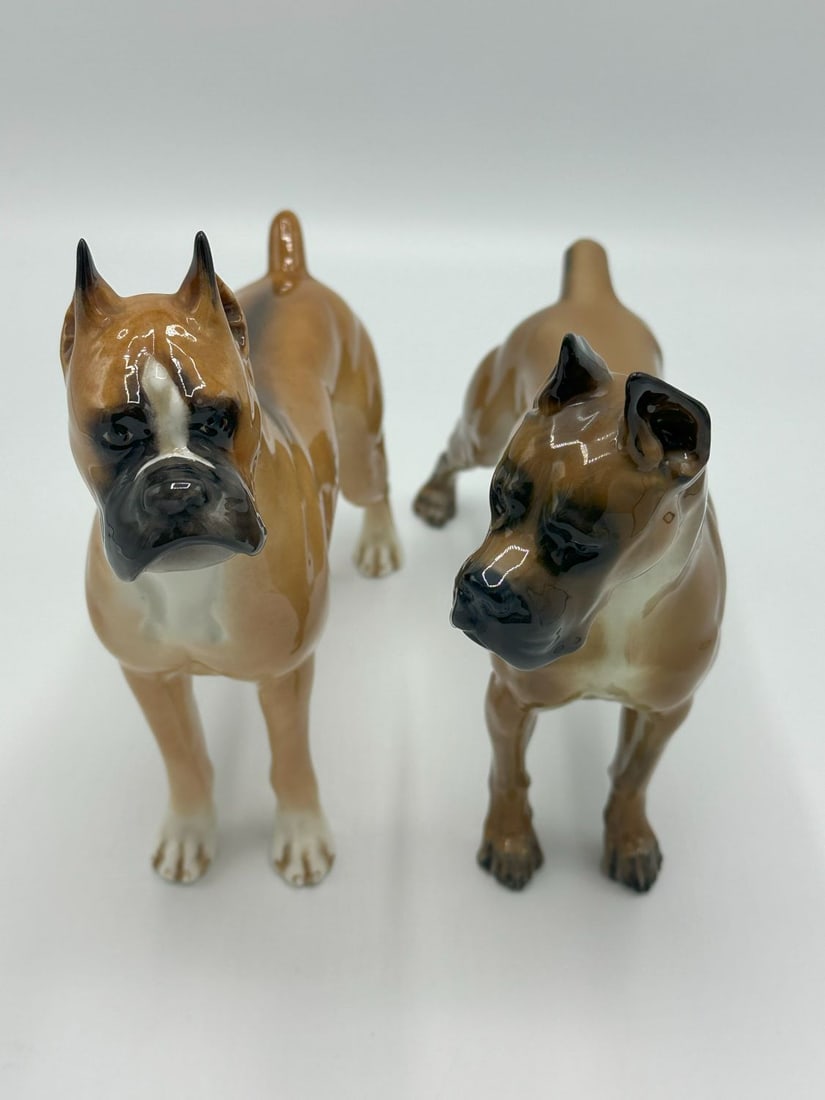 Lot of 2 -Boehm Porcelain Boxer and Rose Rosenthal Porcelain Boxer Figurine: Lot of 2 -Porcelain Boxer Figurine, Rose Rosenthal, Made in Germany and Porcelain Boxer Figurine by Boehm. Measures 8.5"l x 3"w x 8"h