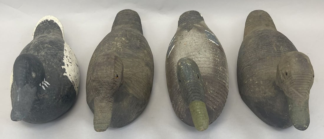 Vintage Duck Decoys Lot (4): Lot of 4 - Vintage Wooden Duck Decoys with intricate detailing and hand-painted accents. Inlaid glass eyes, with swivel head. Makers unknown. Please contact for additional images if desired. Measures