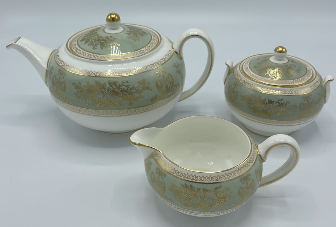 Lot of 3 - WEDGWOOD Gold Columbia Creamer, Sugar Bowl, and Tea Pot: Lot of 3 - WEDGWOOD Gold Columbia (Sage Green) Creamer, Sugar Bowl w/Lid, and Tea Pot w/Lid. Gold Rim. Piece of 3. Bone China Made in England. Smallest Creamer incl. Handle length measures approx. 5.5