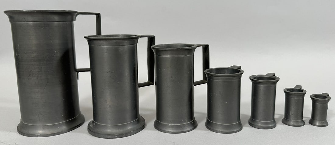 Set of 7 - Vintage Axel Hasselstrom Pewter Measurement Cups: Set of 7 - Vintage Axel Hasselstrom pewter measurement cups. D: Largest diameter 4 x H7, smallest diamater 1 x H1.70 in.