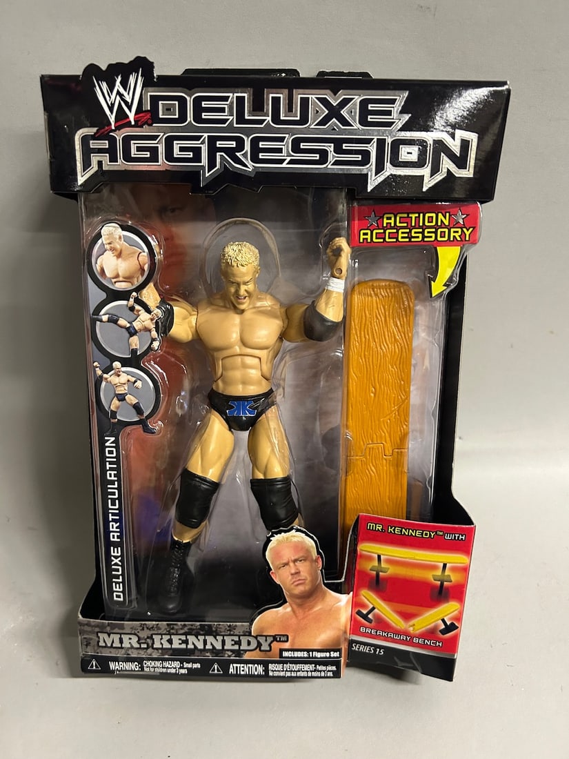 Collection of Jakks Pacific Deluxe Aggression Series Wrestlers: Includes Deluxe Aggression Series 12 Shawn Michaels. Includes Deluxe Aggresion Series 13 John Cena and Triple H. Includes Deluxe Aggression Series 14 MVP. Includes Deluxe Aggression Series 15 Mr. Kenn