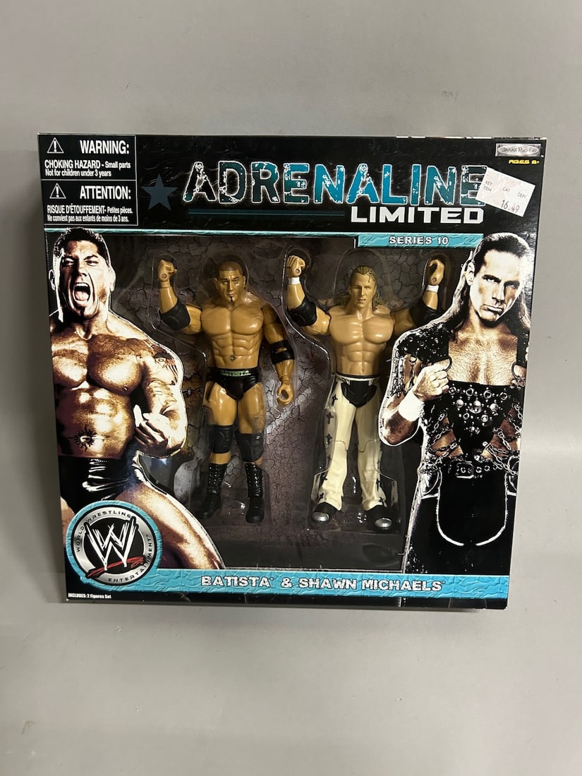 Collection of Various Jakks Pacific Wrestling Action Figure Packages: Includes Road to Wrestlemania XXIV with Ric Flair and Shawn Michaels. Includes Deluxe Build N' Brawl with Triple H and Randy Orton. Includes Adrenaline Series 34 with JBL and Randy Orton. Includes Adr