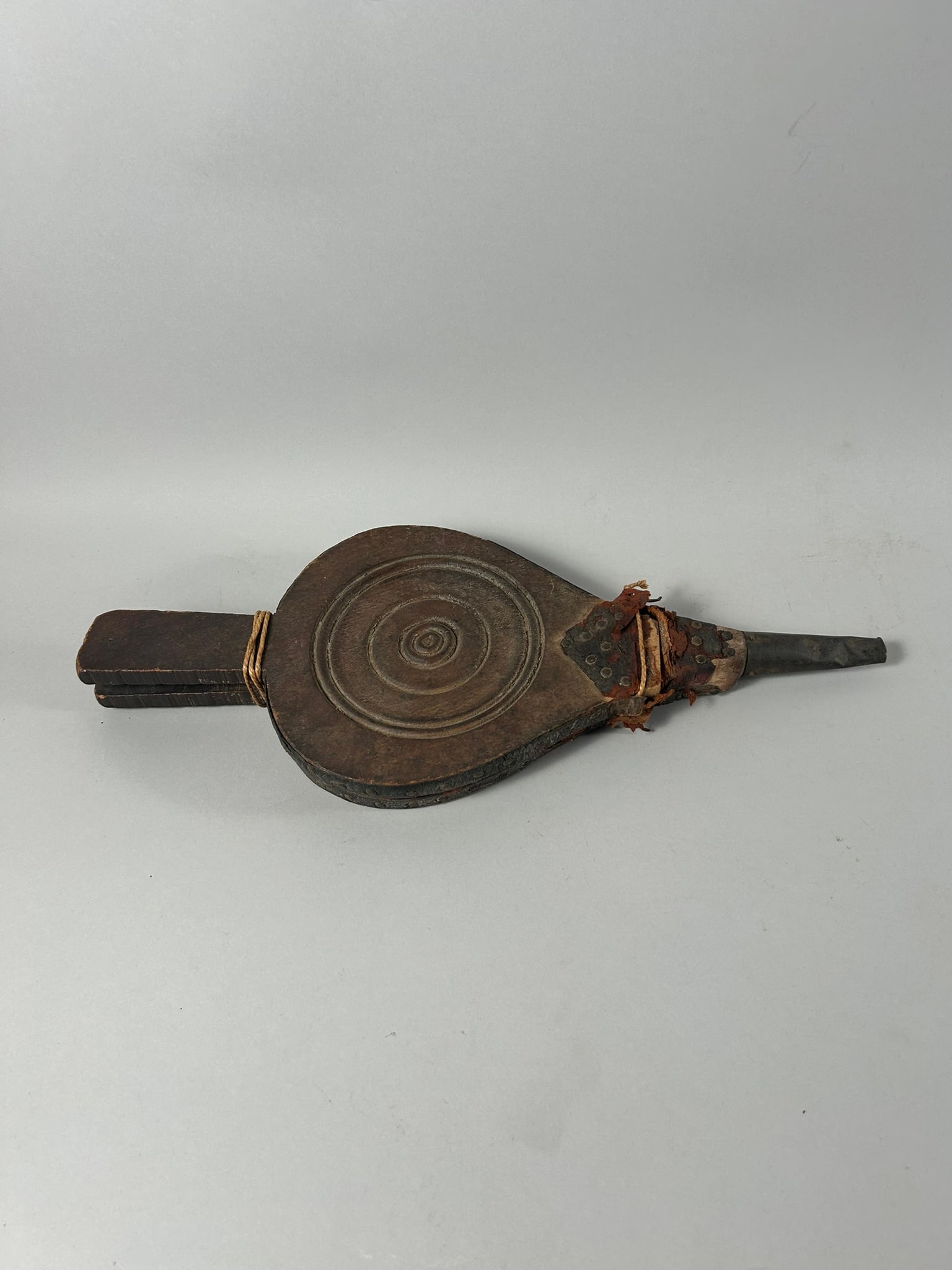 Kuba Style Bellows: Wood bellows, with decorative metal elements, metal end, and metal chain, Kuba style, Democratic Republic of the Congo, Central Africa. Dimensions (approx.): 15.5" x 6" x 1.25" PROVENANCE:From the est