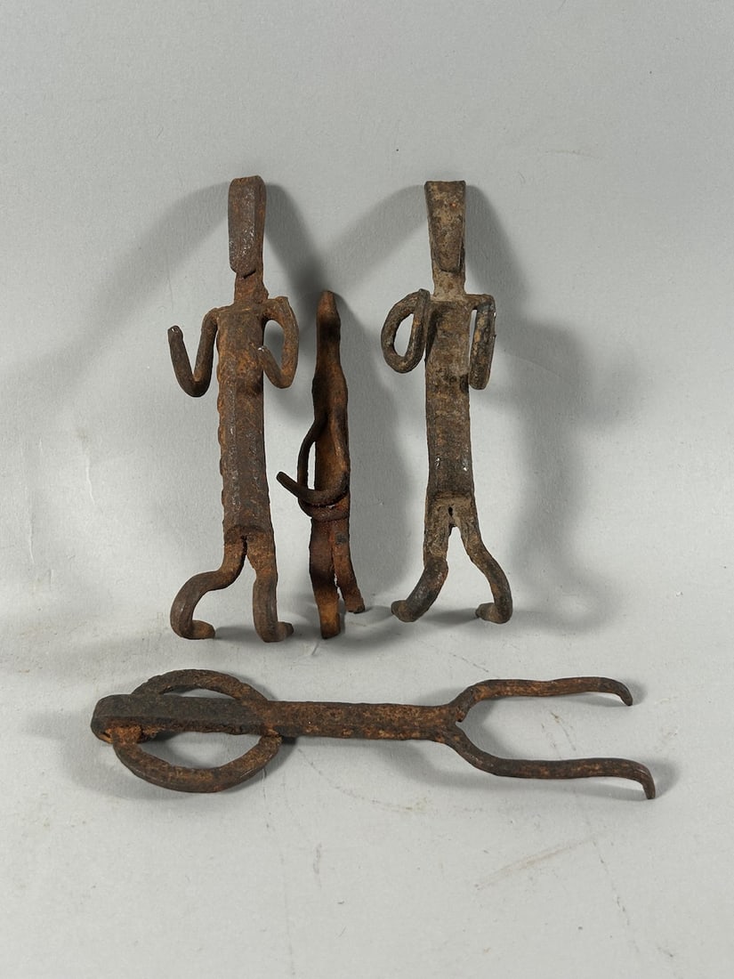 Wrought Iron Figures (4): Four (4) wrought iron figures, various cultures, West Africa. Dimensions (approx.): 5" high (tallest) to 3.75" high (smallest) PROVENANCE:From the estate of Professor Philip Gould, New York