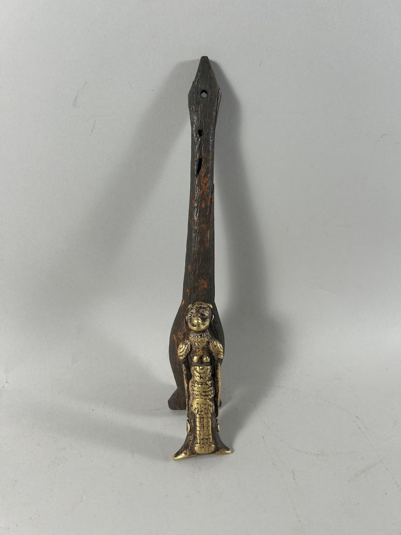 Copper Alloy & Wood Flutes (2): Two (2) flutes/whistles, one (1) copper alloy, and one (1) wood, Mali, West Africa. Dimensions (approx.): 4" (shorter) and 9.5" (longer) PROVENANCE:From the estate of Professor Philip Gould, New York