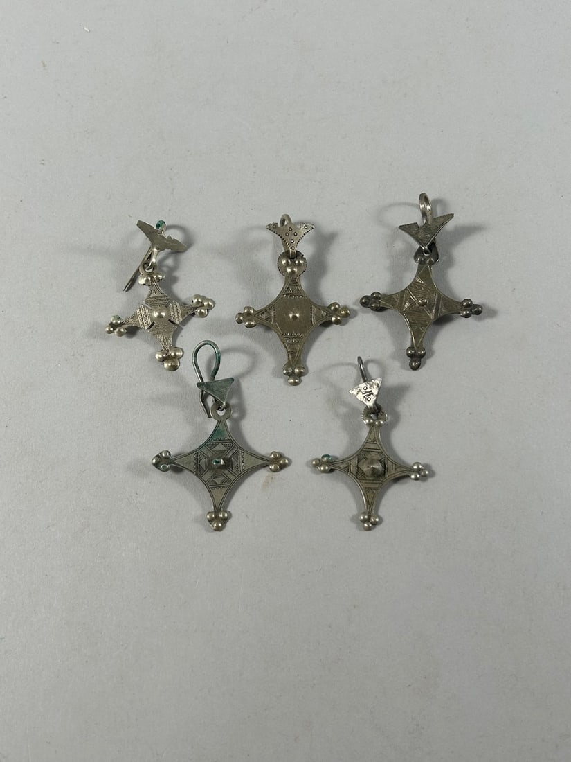 Tuareg Earrings (5): Five (5) single earrings in silver or white metal alloy, Tuareg peoples, Niger, West Africa. Dimenions (approx.): Drop 2.25" - 2.5" PROVENANCE:From the estate of Professor Philip Gould, New York