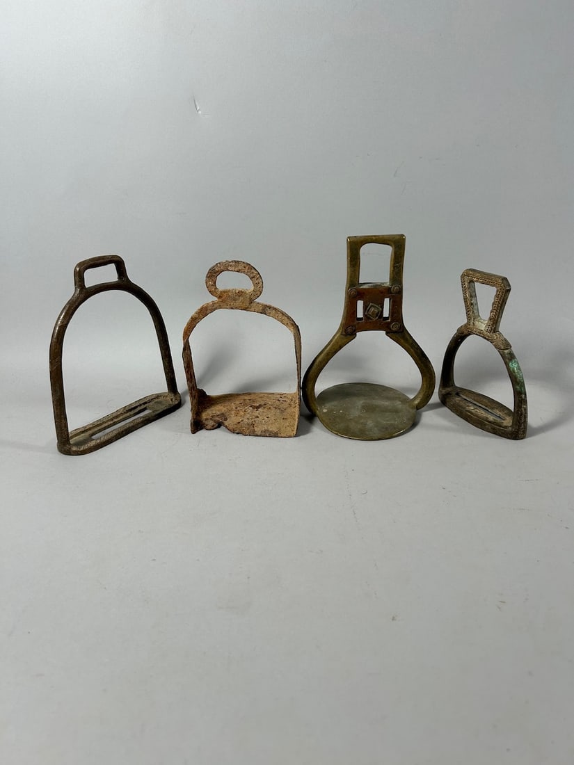 Iron and Copper Alloy Stirrups (4): Four (4) stirrups, including one made of iron, two of copper alloy, and one of copper alloy with copper mountings; believed African but of unknown cultures. Dimensions (approx.): 6.75" x 4.75" x 4.25"