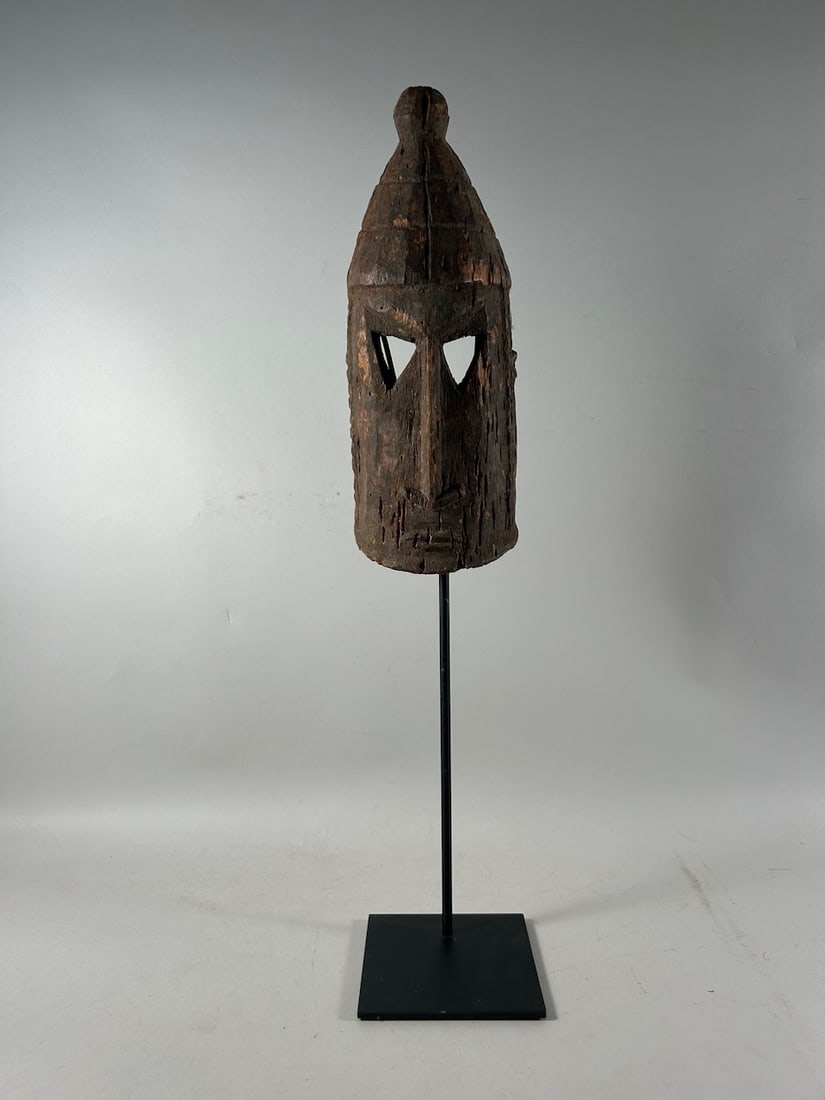 Dogon Style Mask: Dogon style wood mask, Mali, West Africa. Dimensions (approx.): 14.5" x 6" x 5" NOTE: Display stand NOT included. PROVENANCE:From the estate of Professor Philip Gould, New York