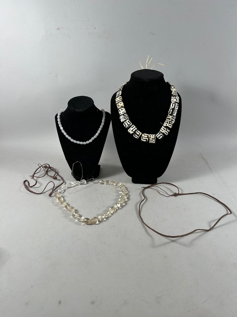 African Necklaces (5): Five (5) necklaces, including two with glass beads, two of woven fiber, and one with batik cow bone beads, various cultures, Africa. Dimensions (approx.): 15.5" drop (longest) to 9.5" drop (shortest) 