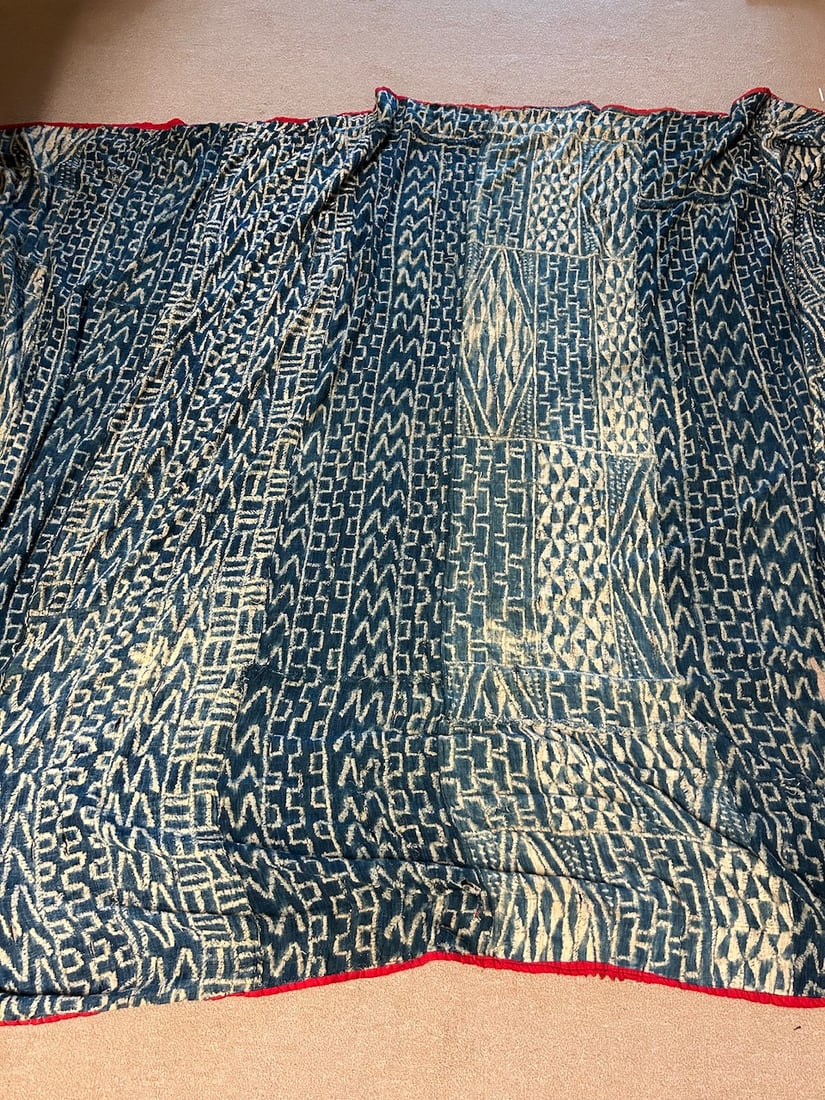 Bamileke Ndop Indigo Cloth: A Bamileke peoples Ndop indigo cloth, red edging possibly a replacement from original edging, Cameroon, West Africa. Dimensions (approx.): 82" x 122" PROVENANCE:From the estate of Professor Philip Gou